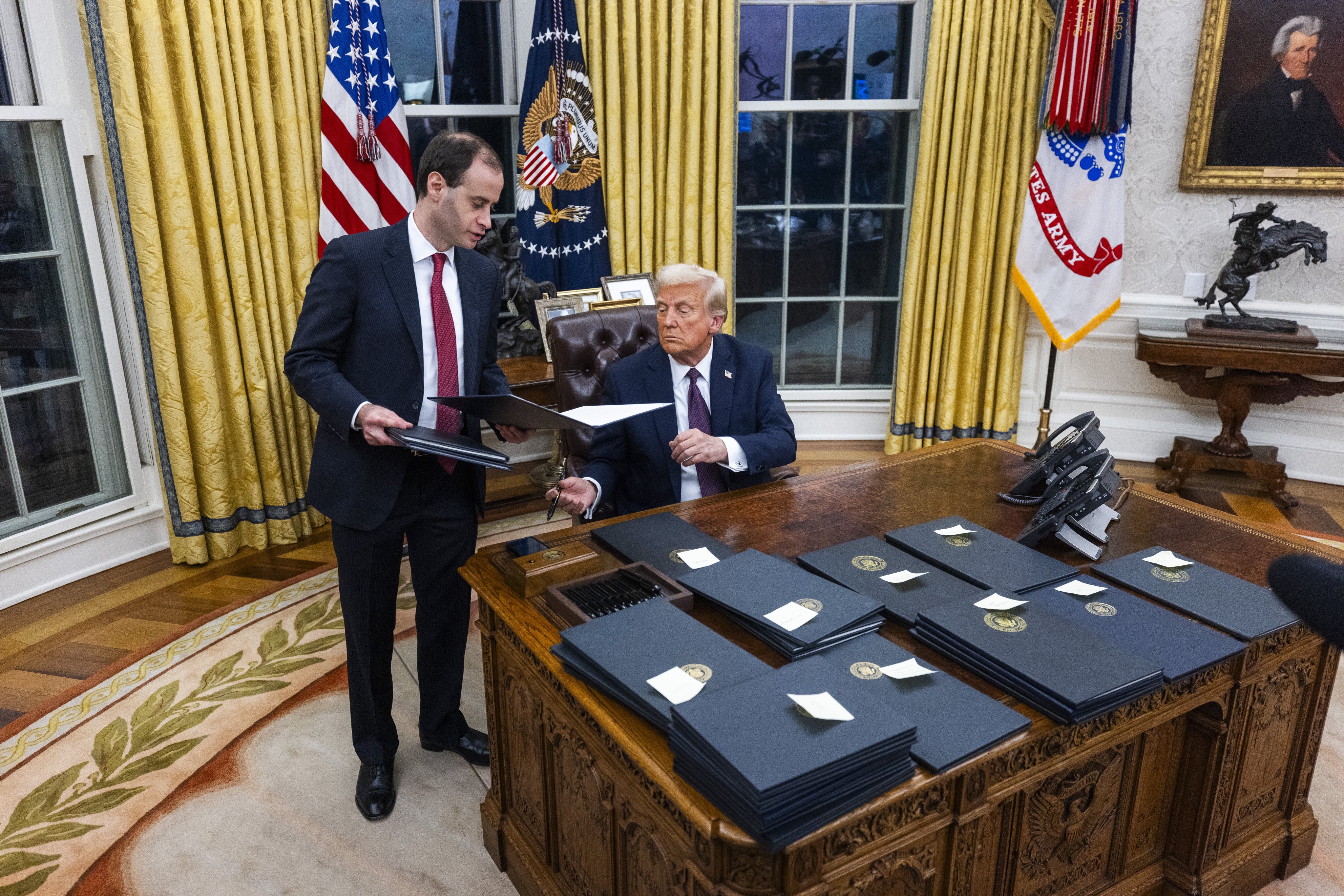 US President Donald Trump signing executive orders on the first day of his second term. Photo: EPA-EFE