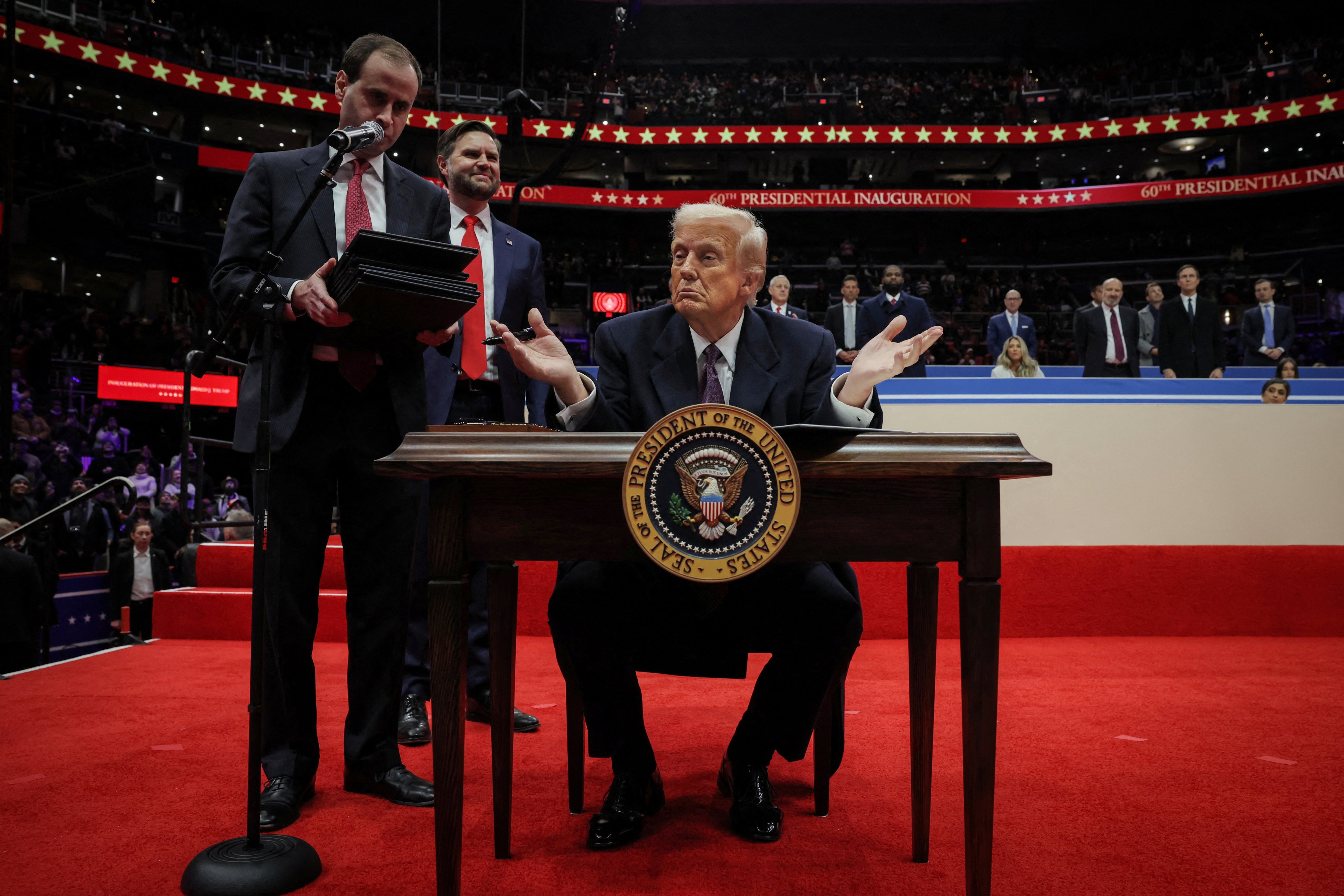 US President Donald Trump gestures as he signs executive orders on the inauguration day of his second presidential term, in Washington, on Monday. Photo: Reuters