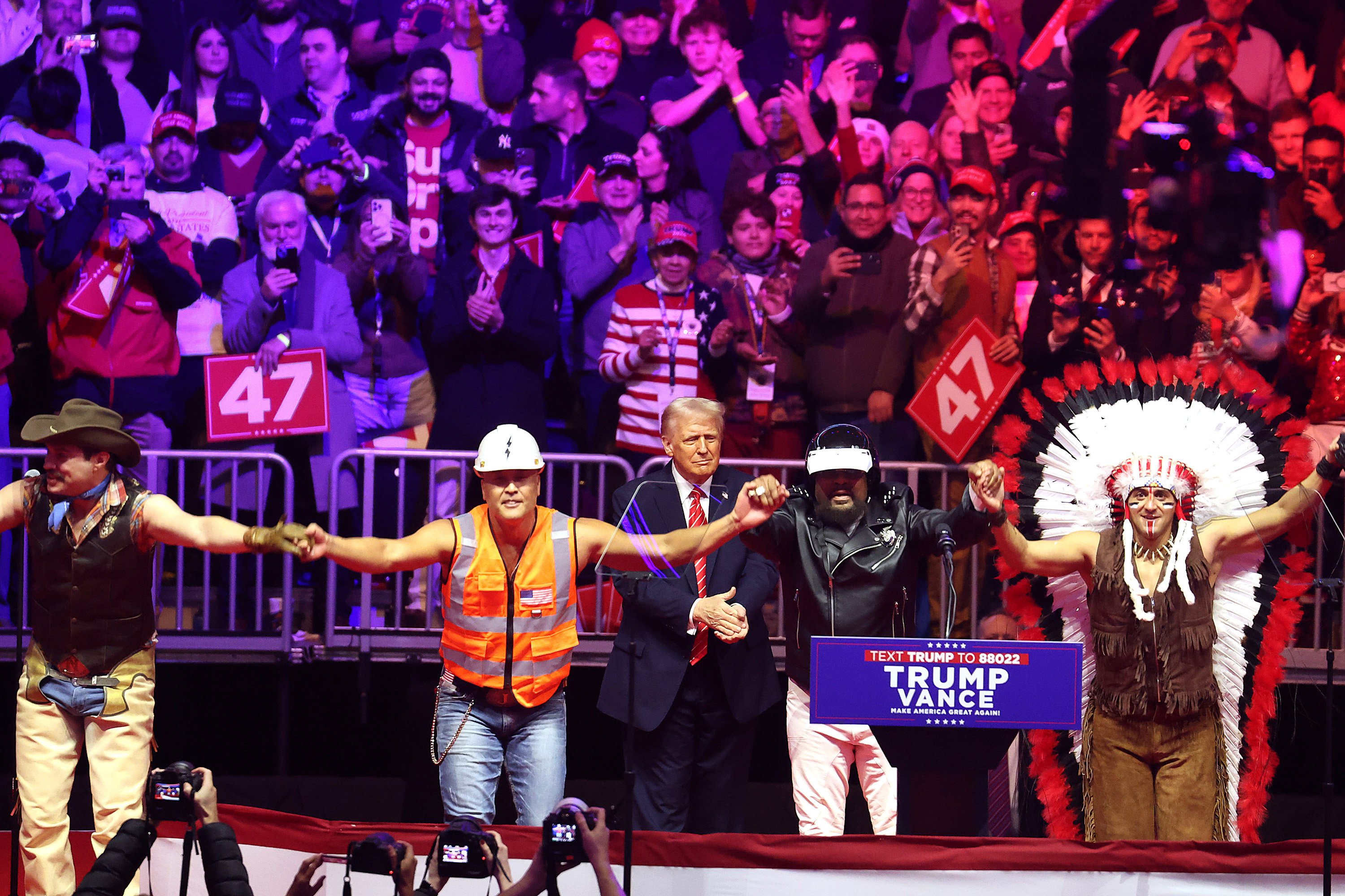 Donald Trump watches the Village People perform YMCA on stage at his victory rally at the Capital One Arena on Sunday. Trump was sworn in as the 47th US president on Monday. Photo: TNS