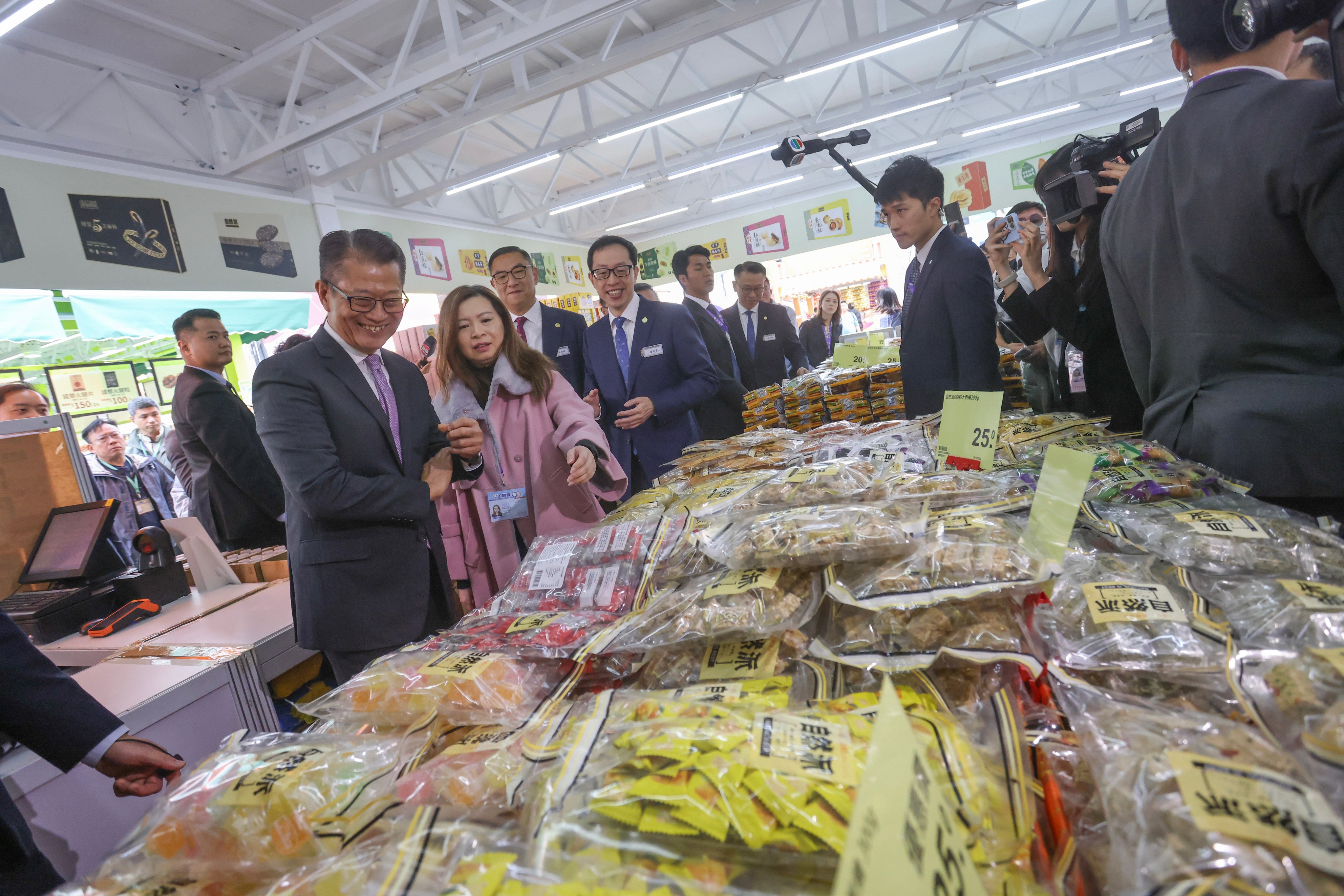 Financial Secretary Paul Chan Mo-po, left, visits the 58th Hong Kong Brands & Products Expo at Victoria Park on December 14, 2024. Photo: Jonathan Wong