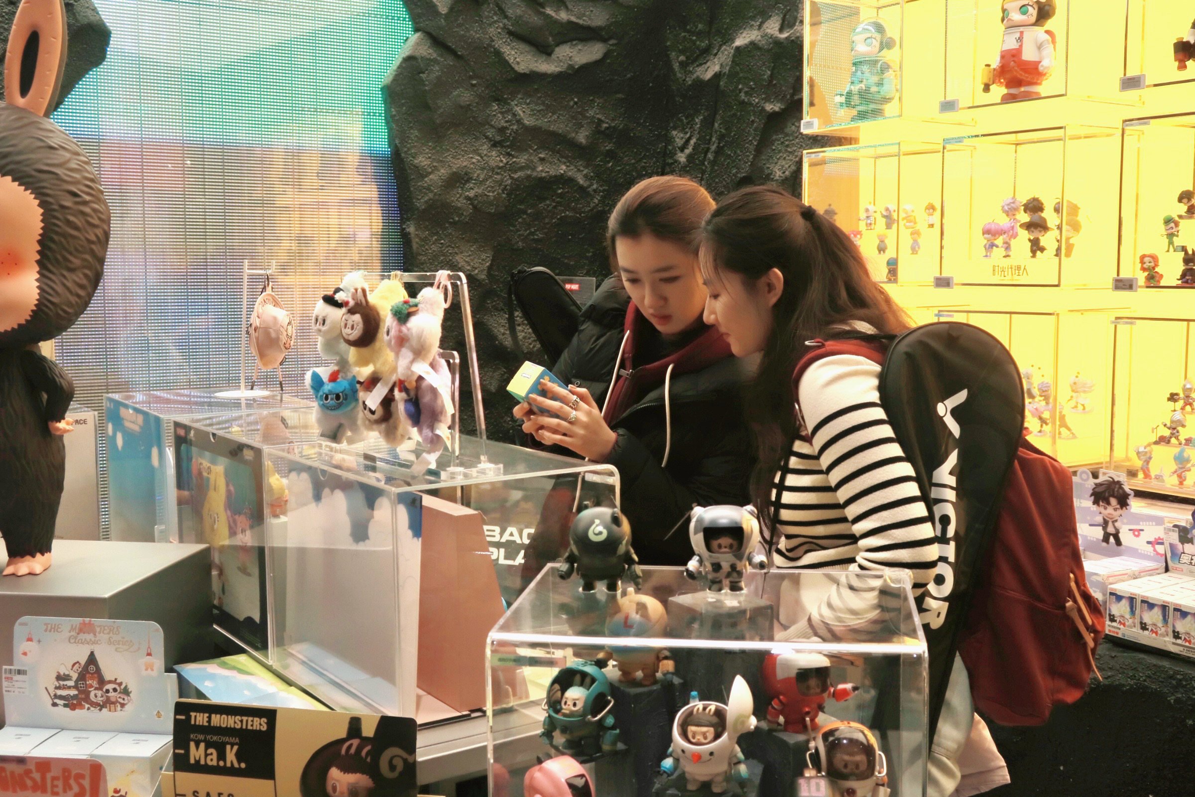 Consumers examine blind boxes at a Pop Mart store in Beijing. The nation’s consumer price index target has increasingly become an indicator of demand. Photo: Xinhua