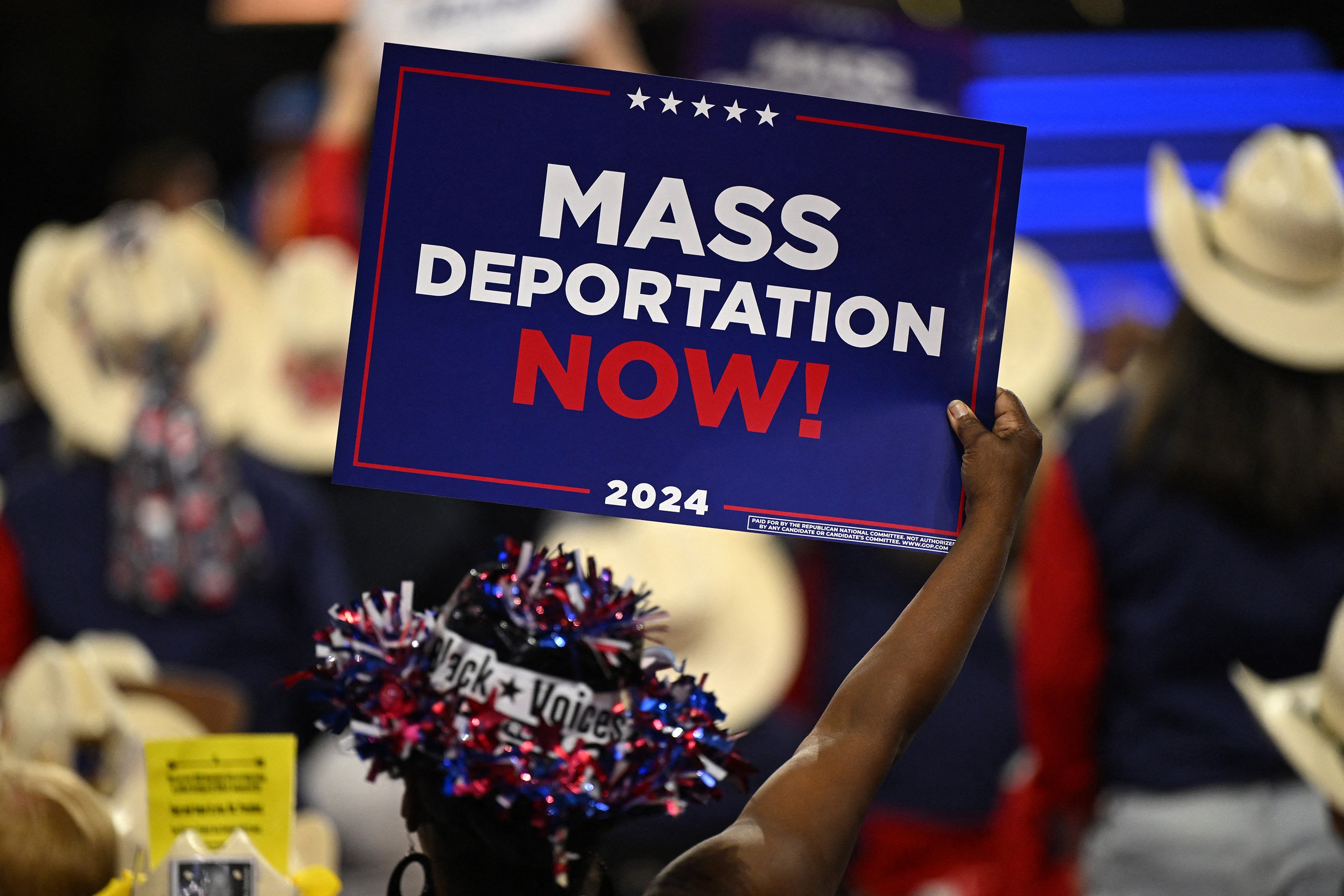 An attendee bears a sign at the Republican National Convention in Milwaukee, Wisconsin, on July 17, 2024. Photo: AFP/Getty Images/TNS