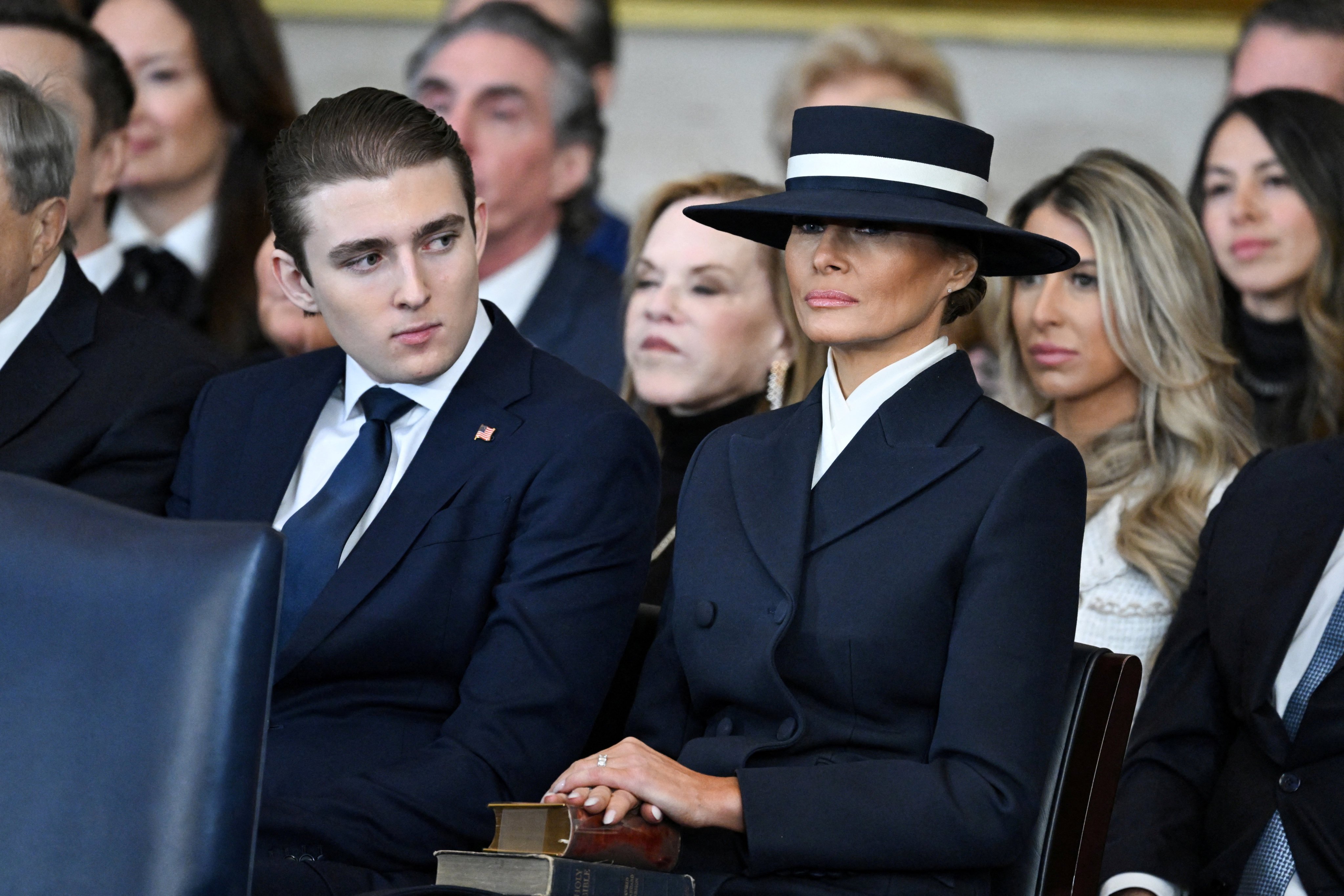 Barron Trump and First Lady Melania Trump listen as US President Donald Trump delivers remarks after being sworn in as the 47th President in the US Capitol Rotunda in Washington, DC, on January 20, 2025.     SAUL LOEB/Pool via REUTERS