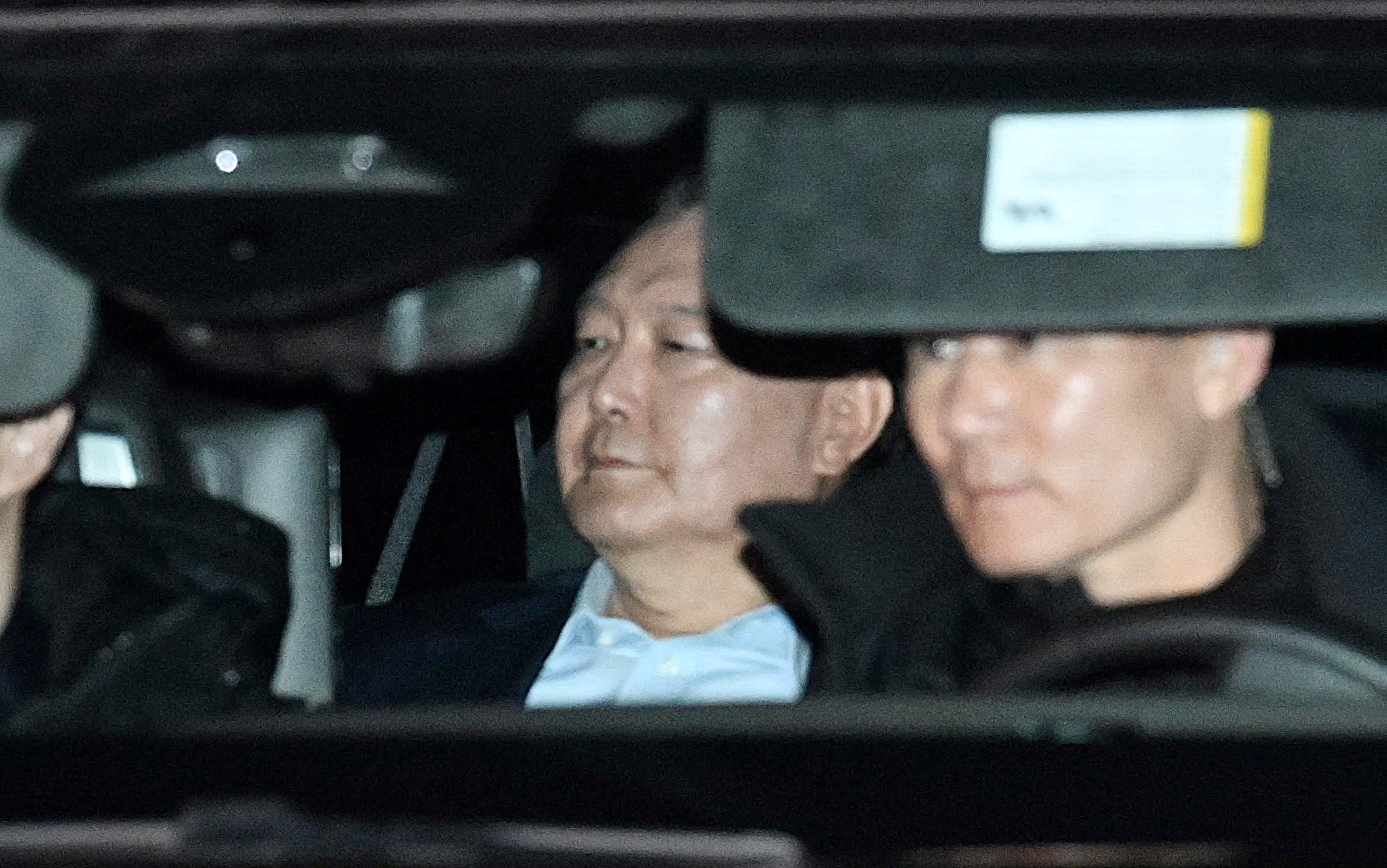 South Korea’s impeached President Yoon Suk-yeol sits as he is wheeled away for detention on January 15, 2025. Photo: Yonhap via Reuters