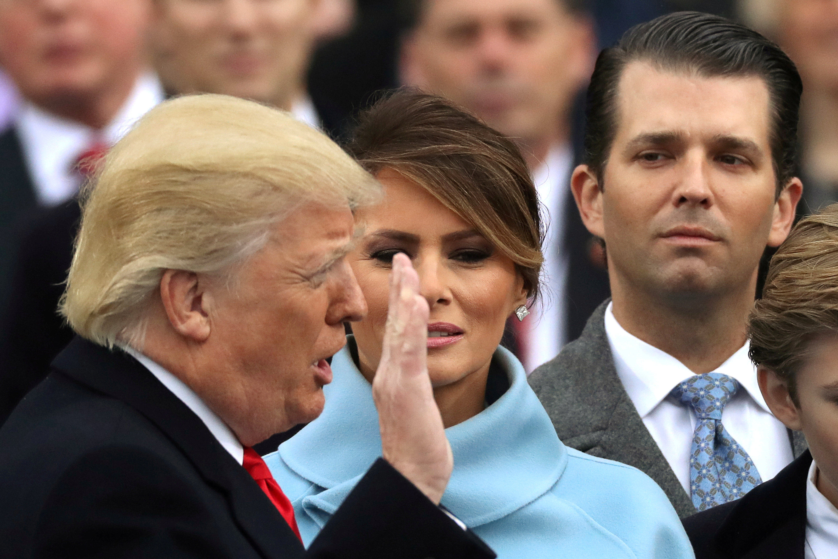 Donald Trump Jr. (right) watches as his father Donald Trump is sworn in as the 45th president of the United States on January 20, 2017. Photo: Reuters