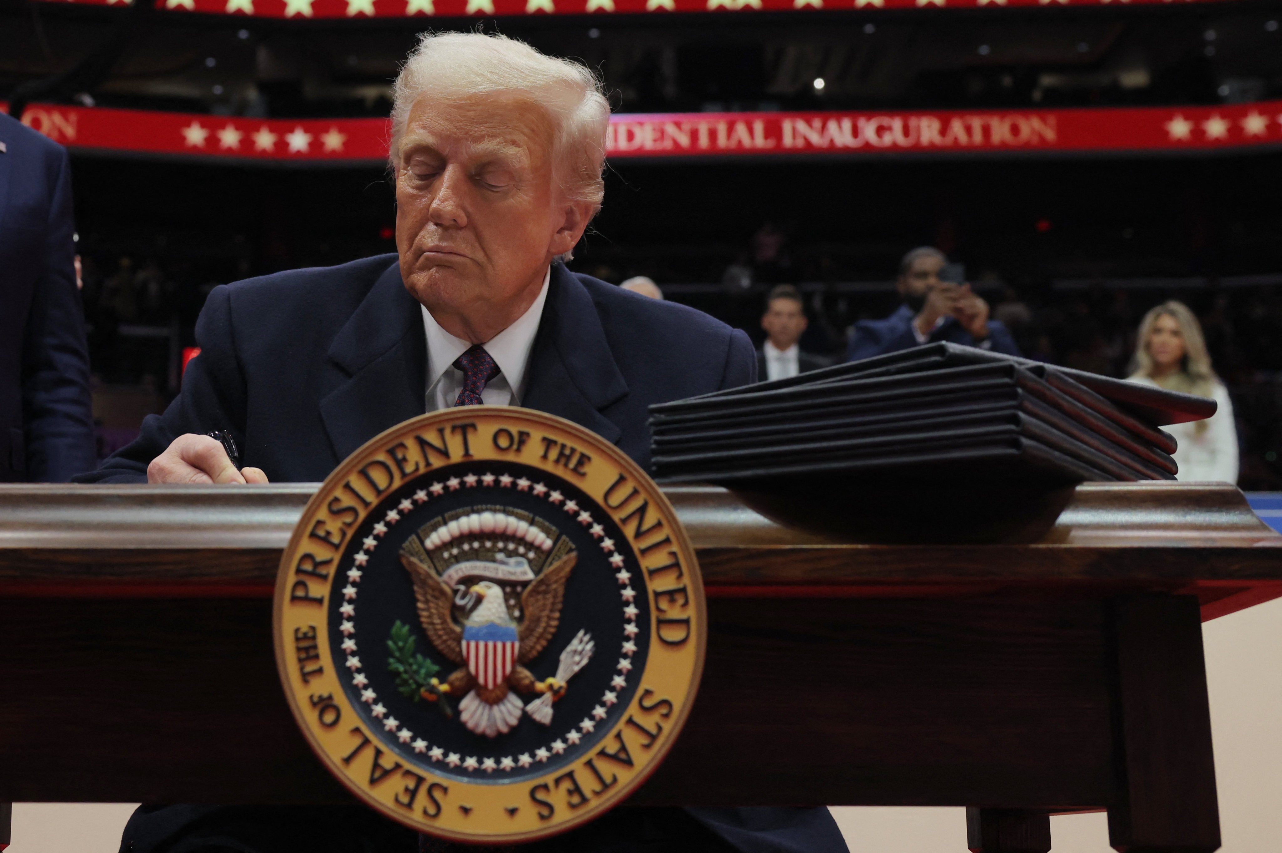 US President Donald Trump signs executive orders on the inauguration day of his second presidential term, in Washington on January 20, 2025. Photo: Reuters