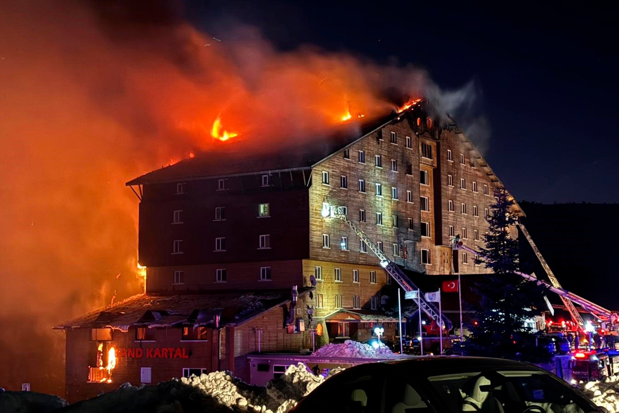 Firefighters try to extinguish the fire. Photo: IHA via AP