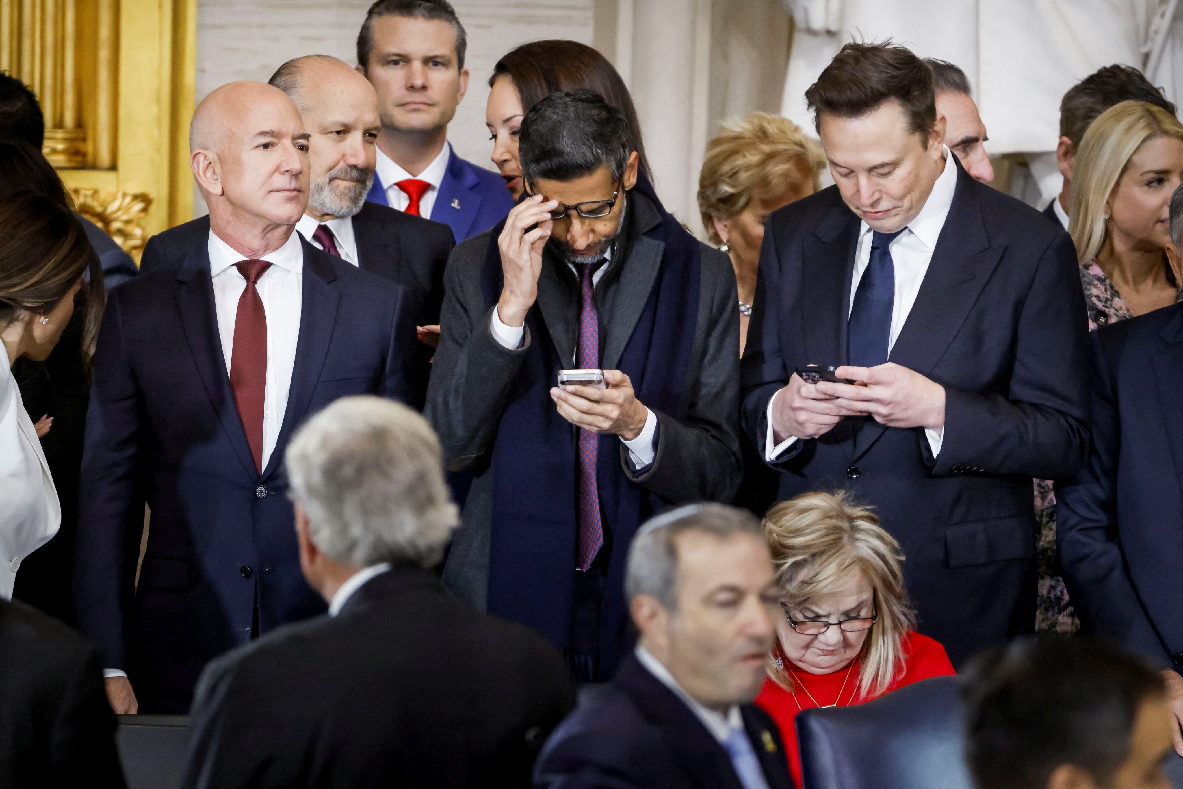 Businessmen Jeff Bezos, Alphabet’s CEO Sundar Pichai and Elon Musk attend Donald Trump’s inauguration. Photo: Pool/Reuters