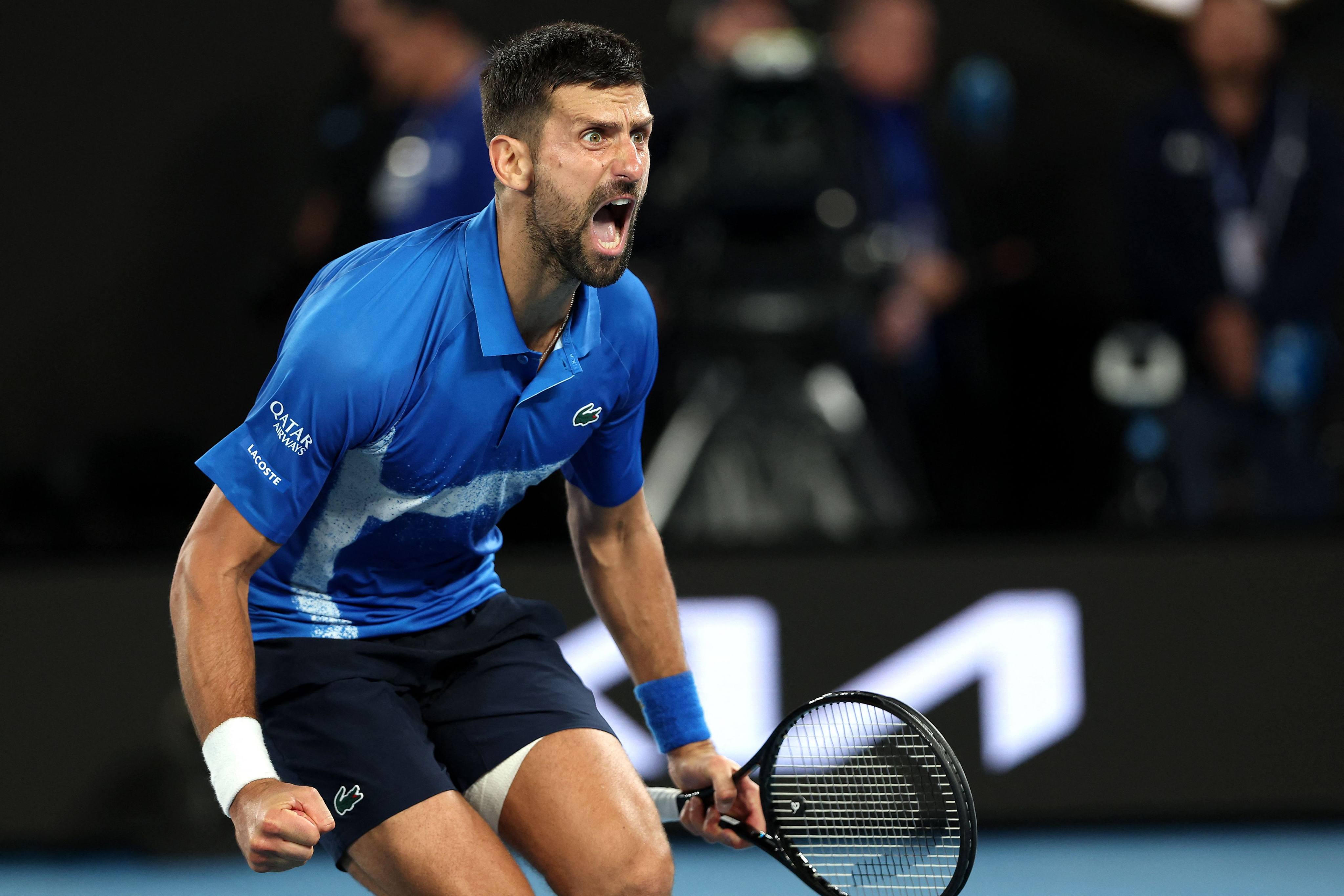 Serbia’s Novak Djokovic celebrates winning match point against Spain’s Carlos Alcaraz in their quarter-final on Tuesday. Photo: AFP