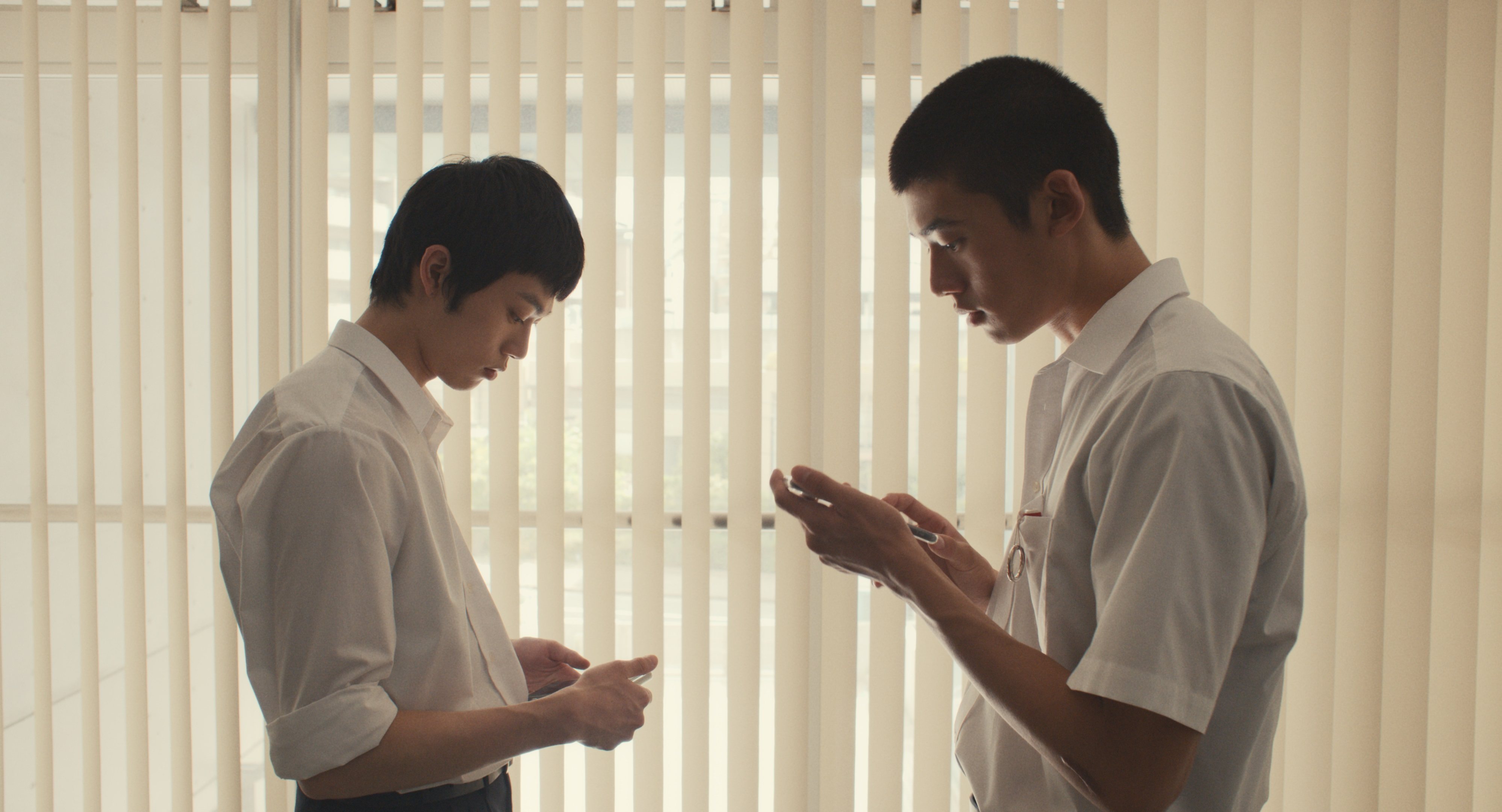 Hayato Kurihara (left) and Yukito Hidaka in a still from Happyend.