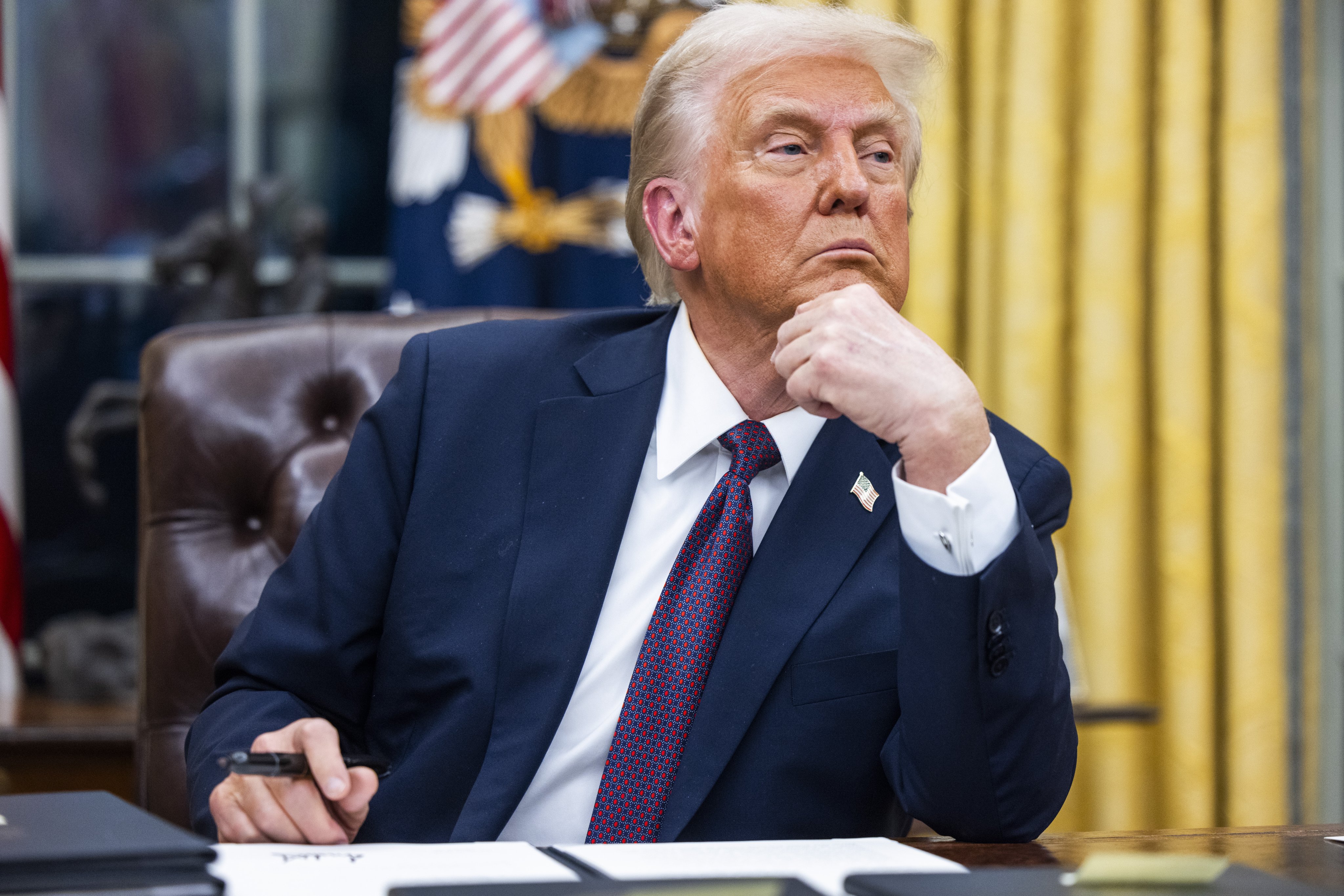 US President Donald Trump signing numerous executive orders on Monday. Photo: EPA-EFE