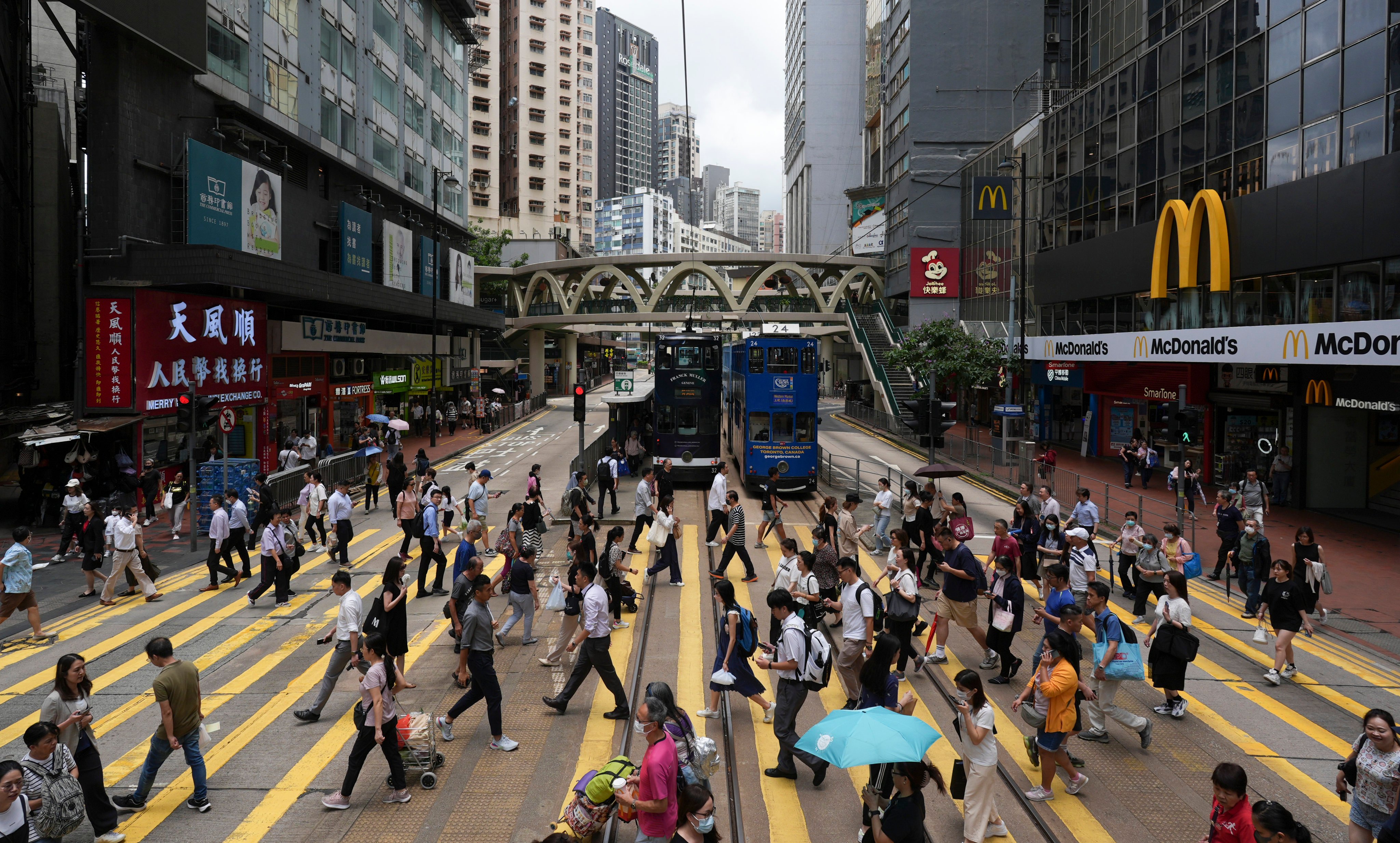 People cross the street in Hong Kong’s shopping hub, Causeway Bay. Photo: Eugene Lee