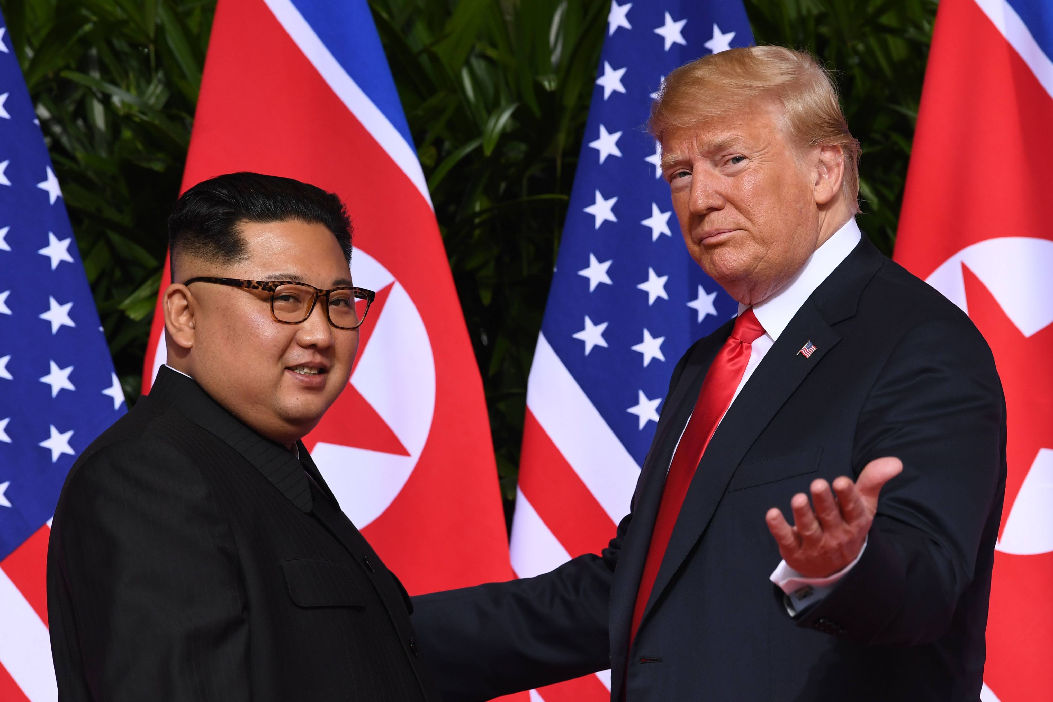 US President Donald Trump gestures as he meets North Korean leader Kim Jong-un at the start of their historic first summit in Singapore in 2018. Photo: AFP