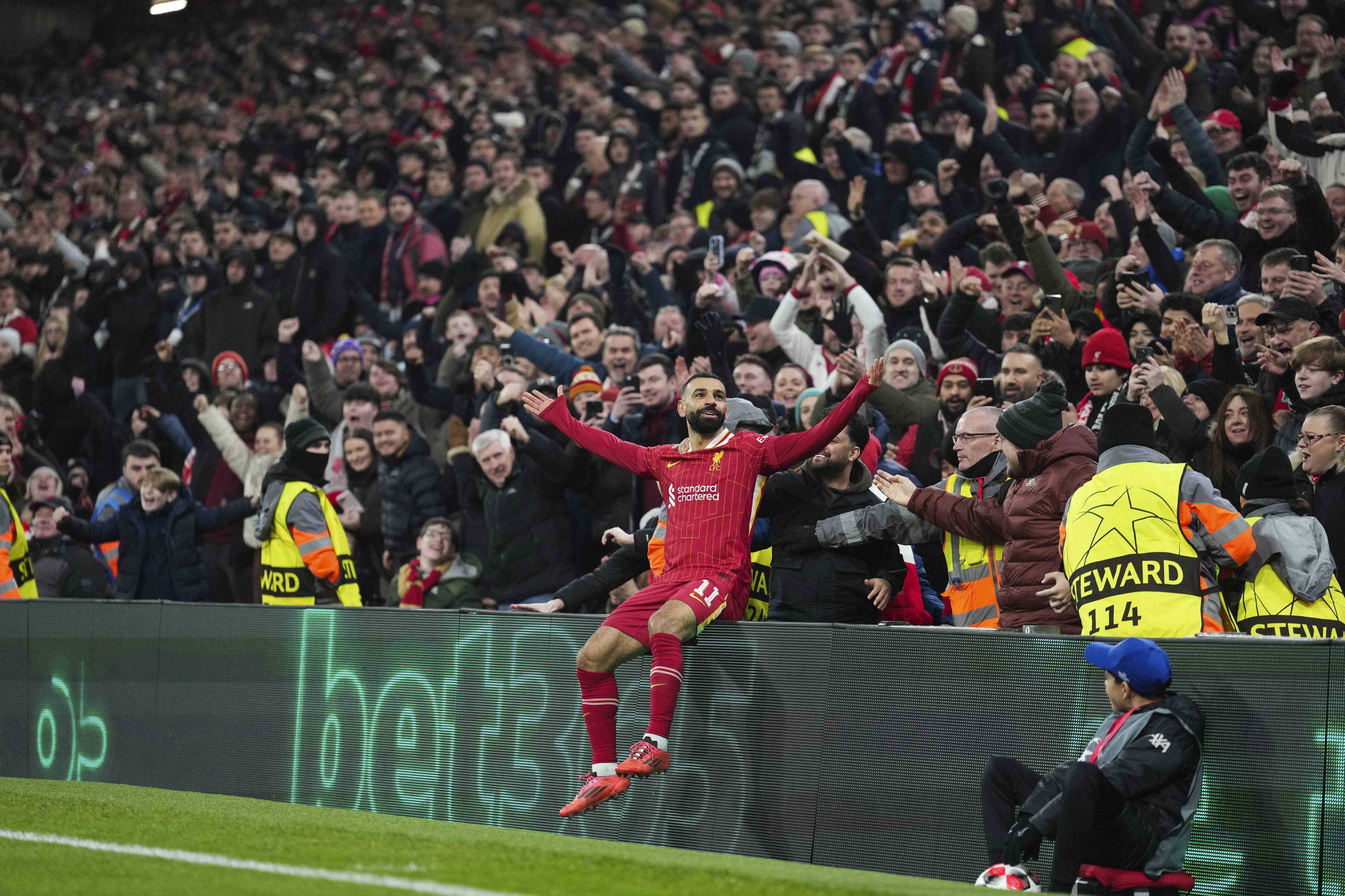 Liverpool’s Mohamed Salah takes the applause from the Anfield crowd after scoring Liverpool’s first against Lille. Photo: AP