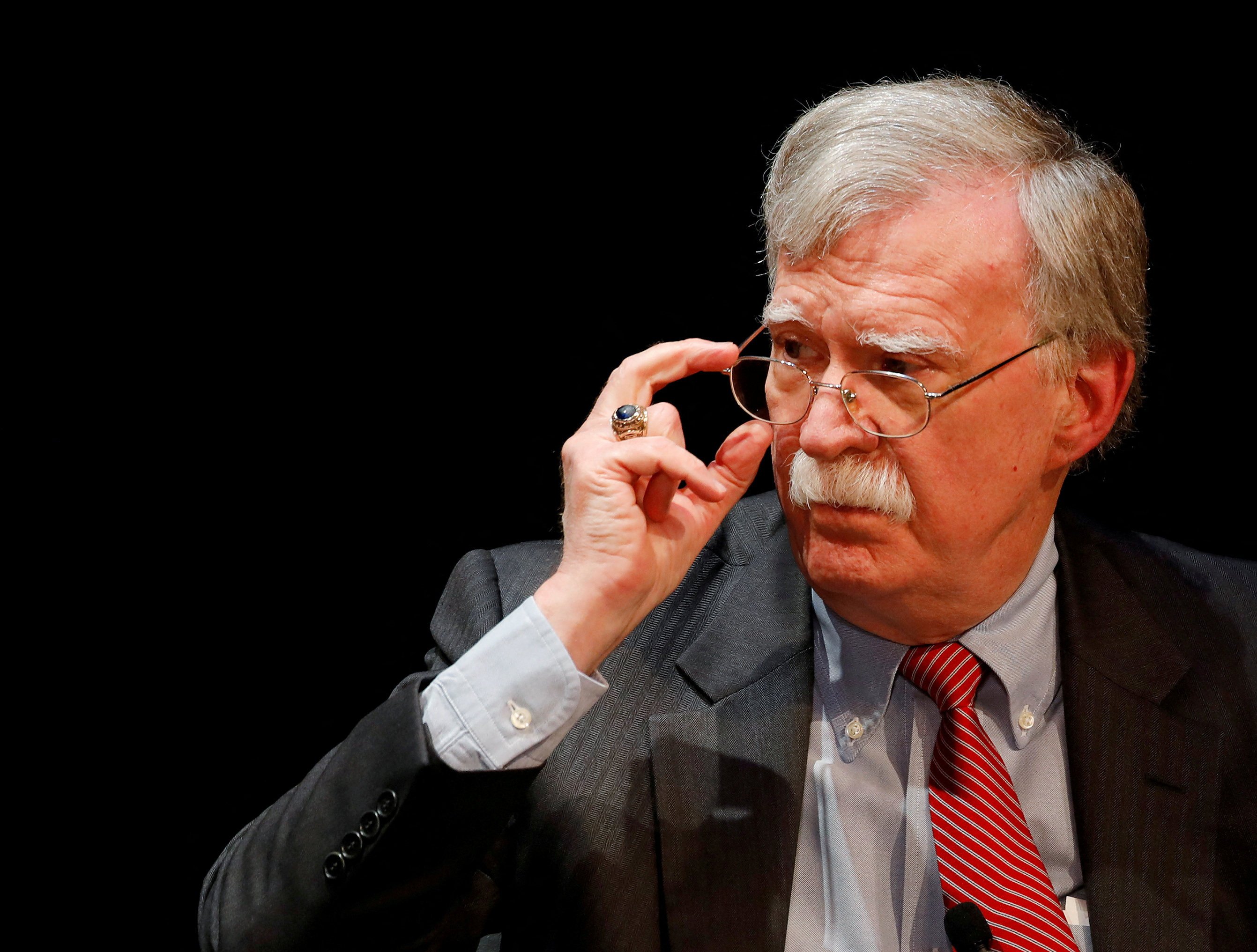 Former US national security adviser John Bolton adjusts his glasses during his lecture at Duke University in Durham, North Carolina, in February 2020. Photo: Reuters