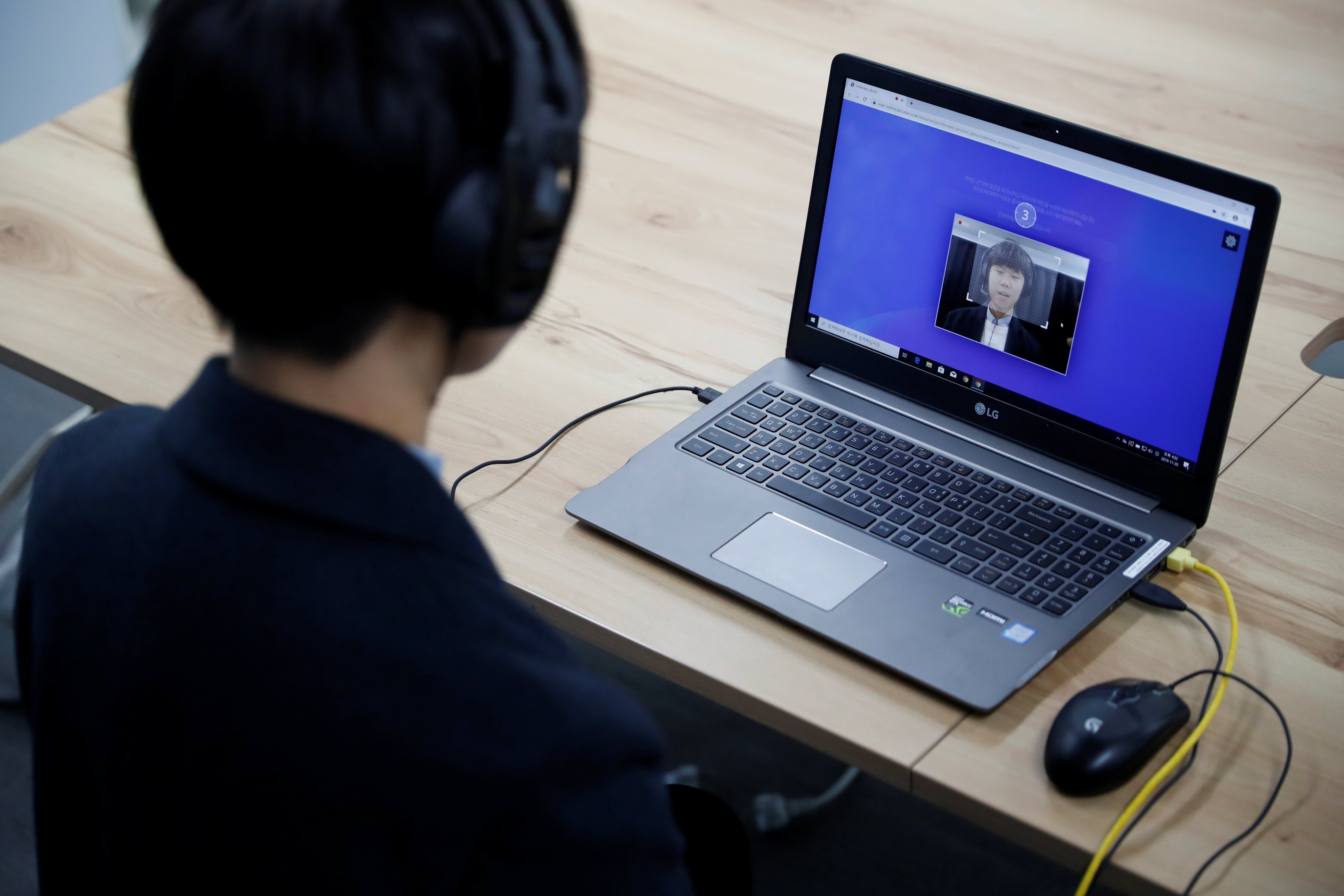 Kim Seok-wu, a university senior majoring in management, demonstrates an AI interview program in Sungnam, South Korea, in January 2020. Photo: Reuters