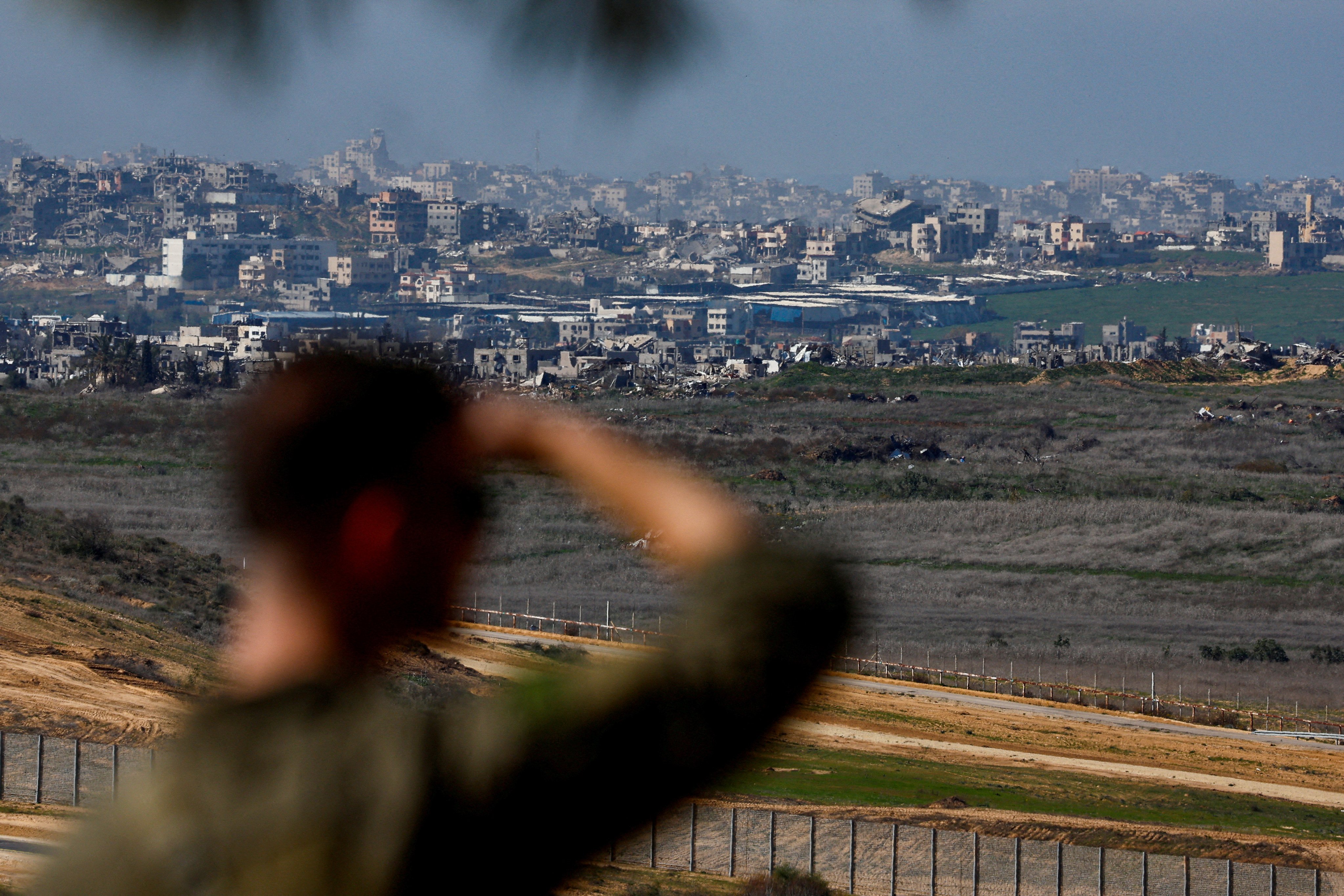 An Israeli soldier stands at a lookout near the border with Gaza on Tuesday amid a ceasefire between Israel and Hamas. Photo: Reuters