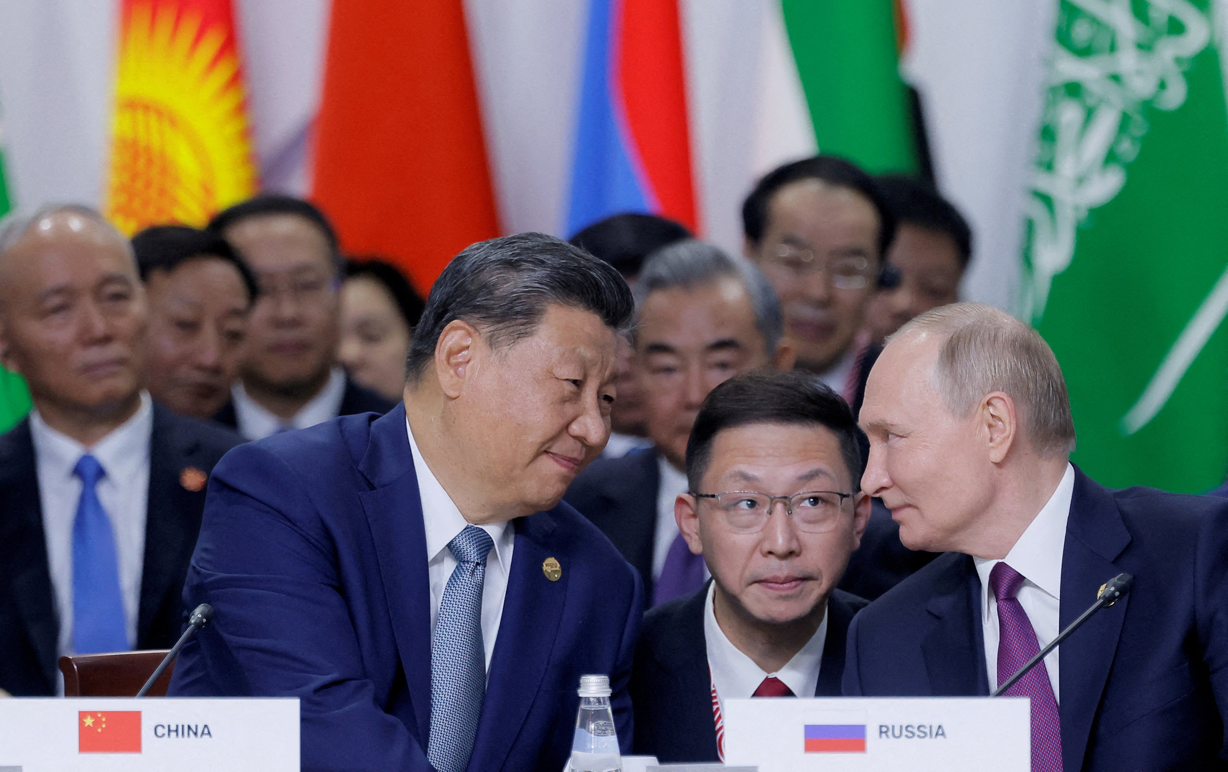 Chinese President Xi Jinping and Russian President Vladimir Putin chat at the Brics summit in Kazan, Russia, on October 24. The two countries are leading the way in collaboration from AI to moon exploration. Photo: Reuters