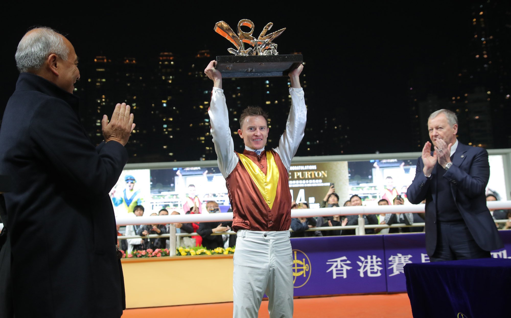 Zac Purton with the specially-designed trophy after his historic achievement.