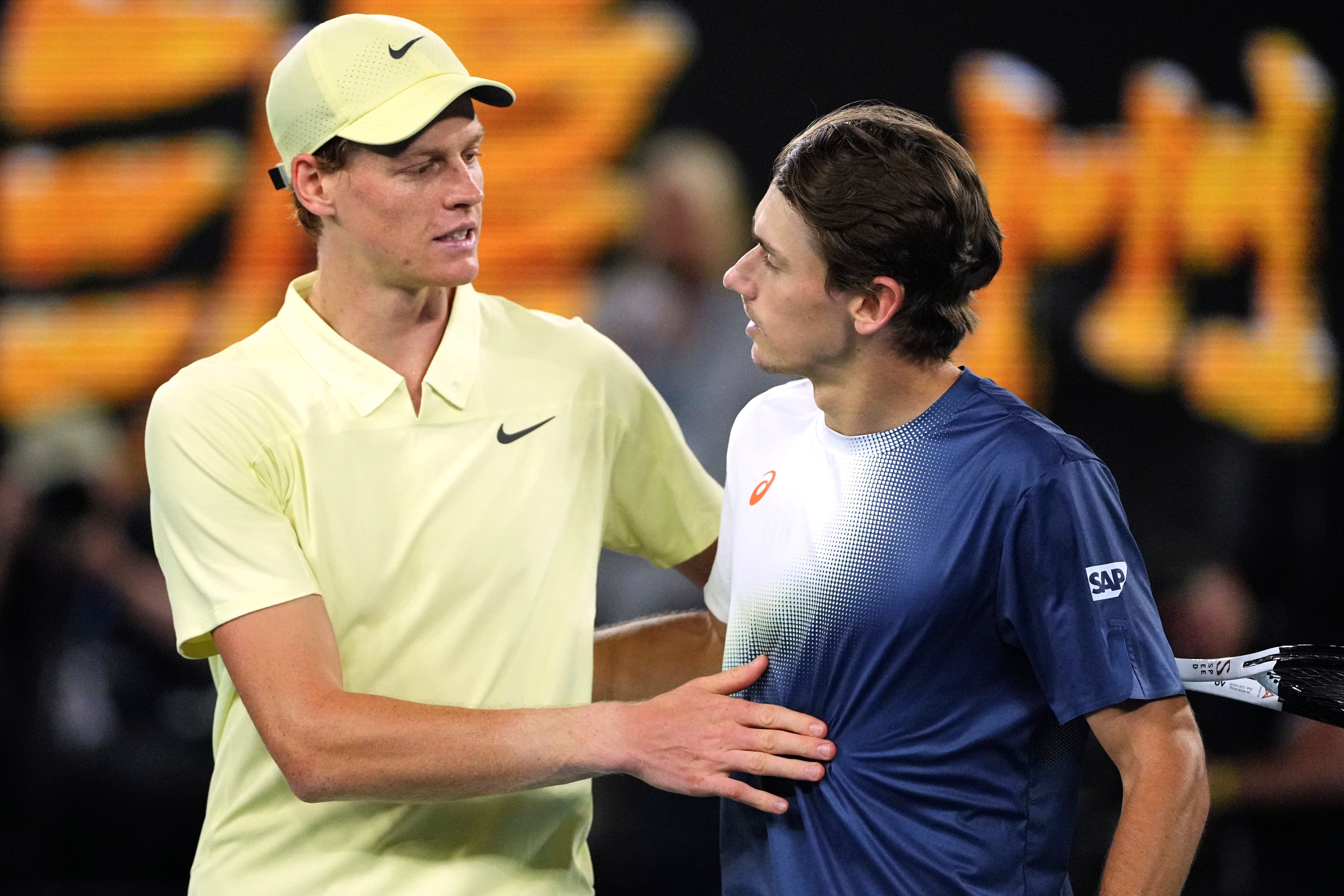 Jannik Sinner (left) congratulated by Australia’s Alex de Minaur after their quarter-final match on Wednesday. Photo: AP