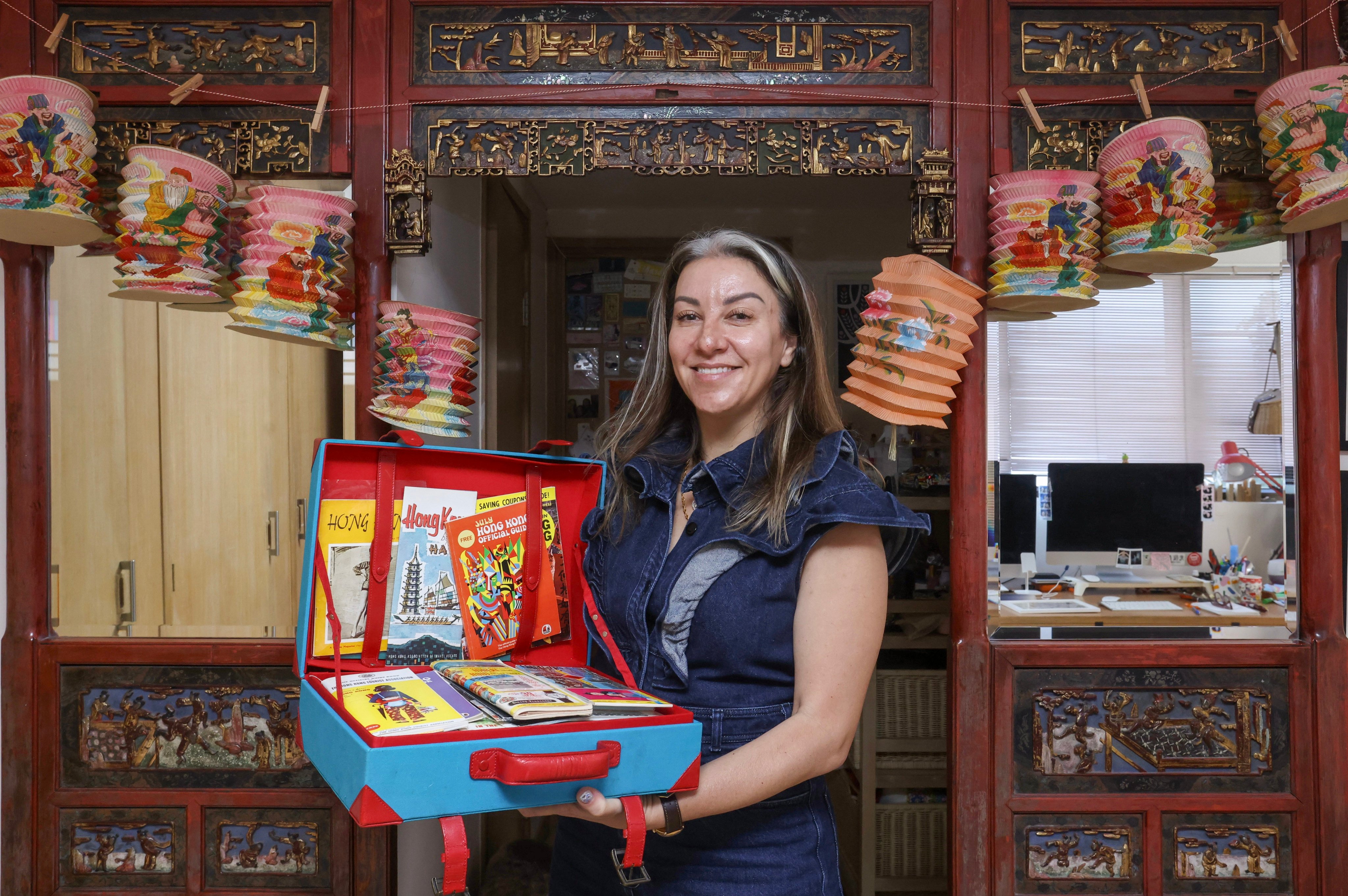 Tarlan Amigh holds items from her vast collection of Hong Kong memorabilia at her home in the city. Many items have been handcrafted using techniques passed down through generations. Photo: Jonathan Wong