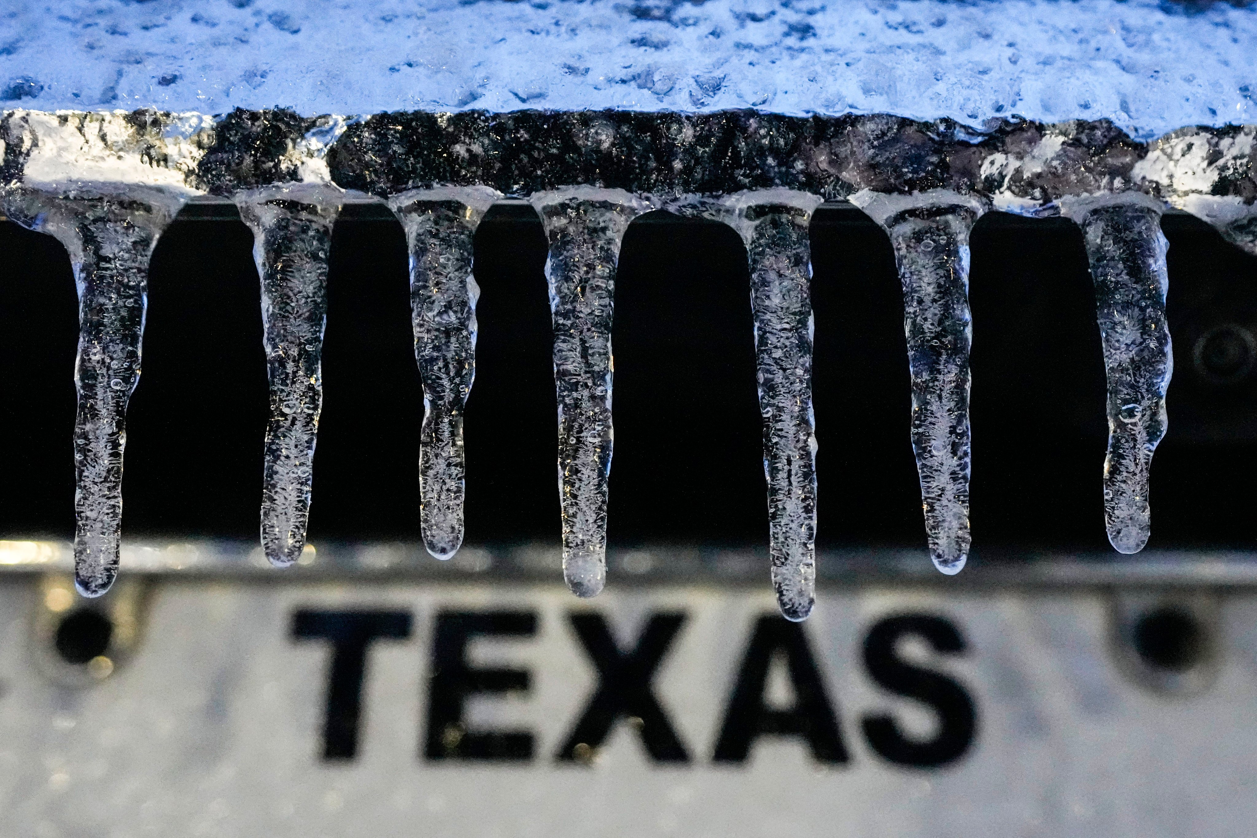 Icicles hang down from a vehicle in Galveston, Texas, on Tuesday. Photo: Houston Chronicle via AP