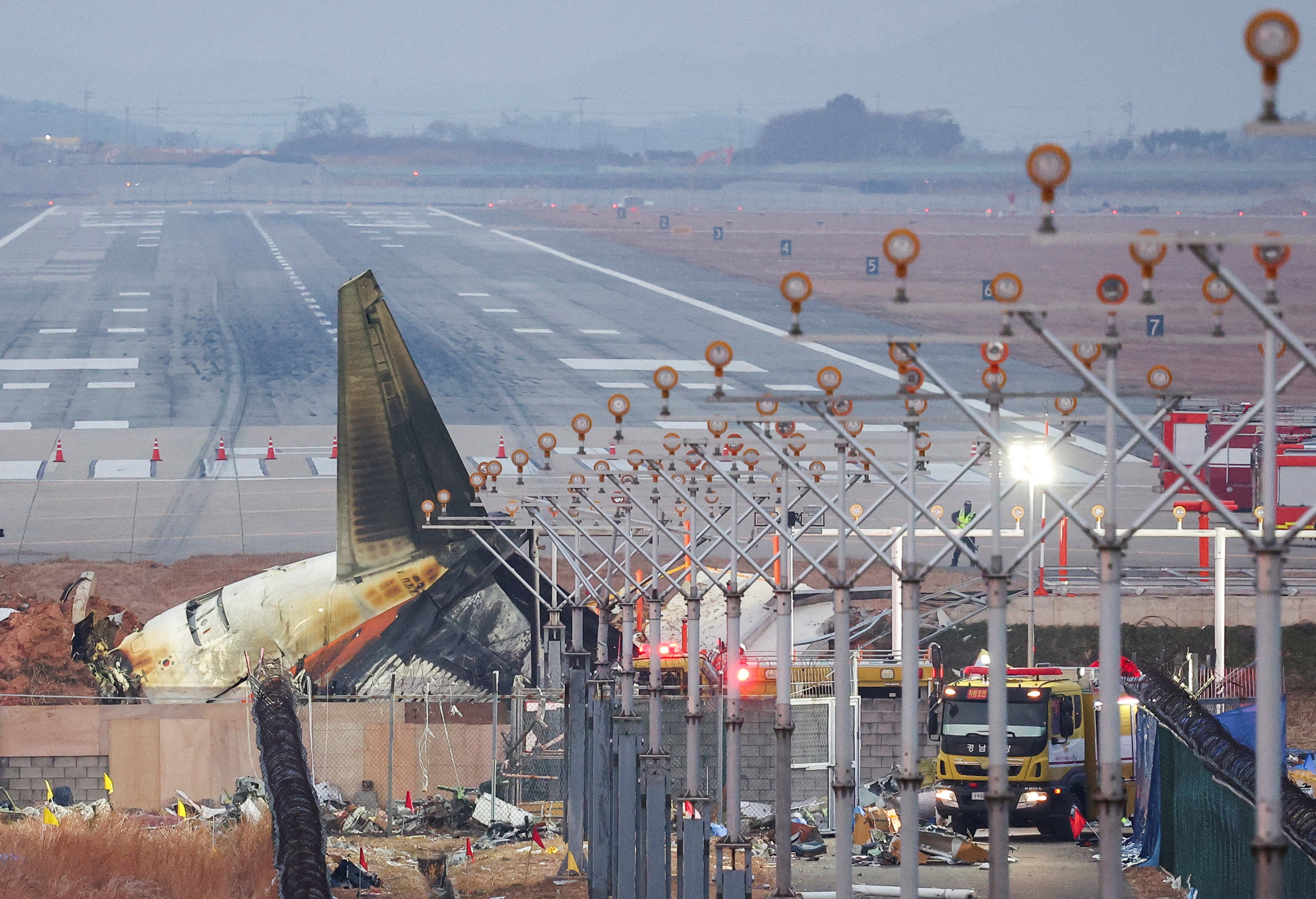 The wreckage of the crashed Jeju Air jet lies at Muan airport in South Korea on December 30. Photo: Reuters