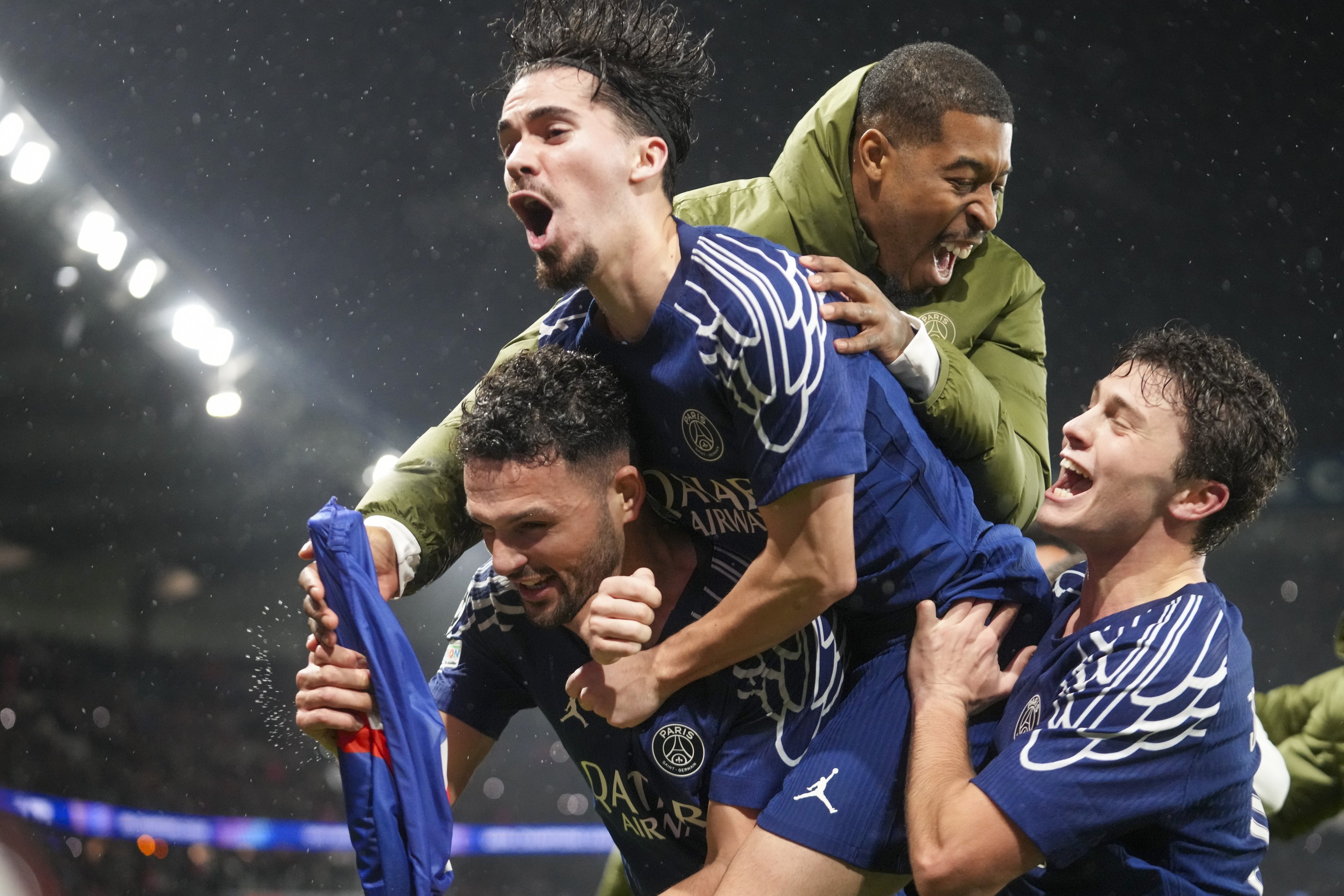 Goncalo Ramos (bottom left) is mobbed by his teammates after scoring  celebrates with teammates after scoring PSG’s fourth against Manchester City. Photo: AP