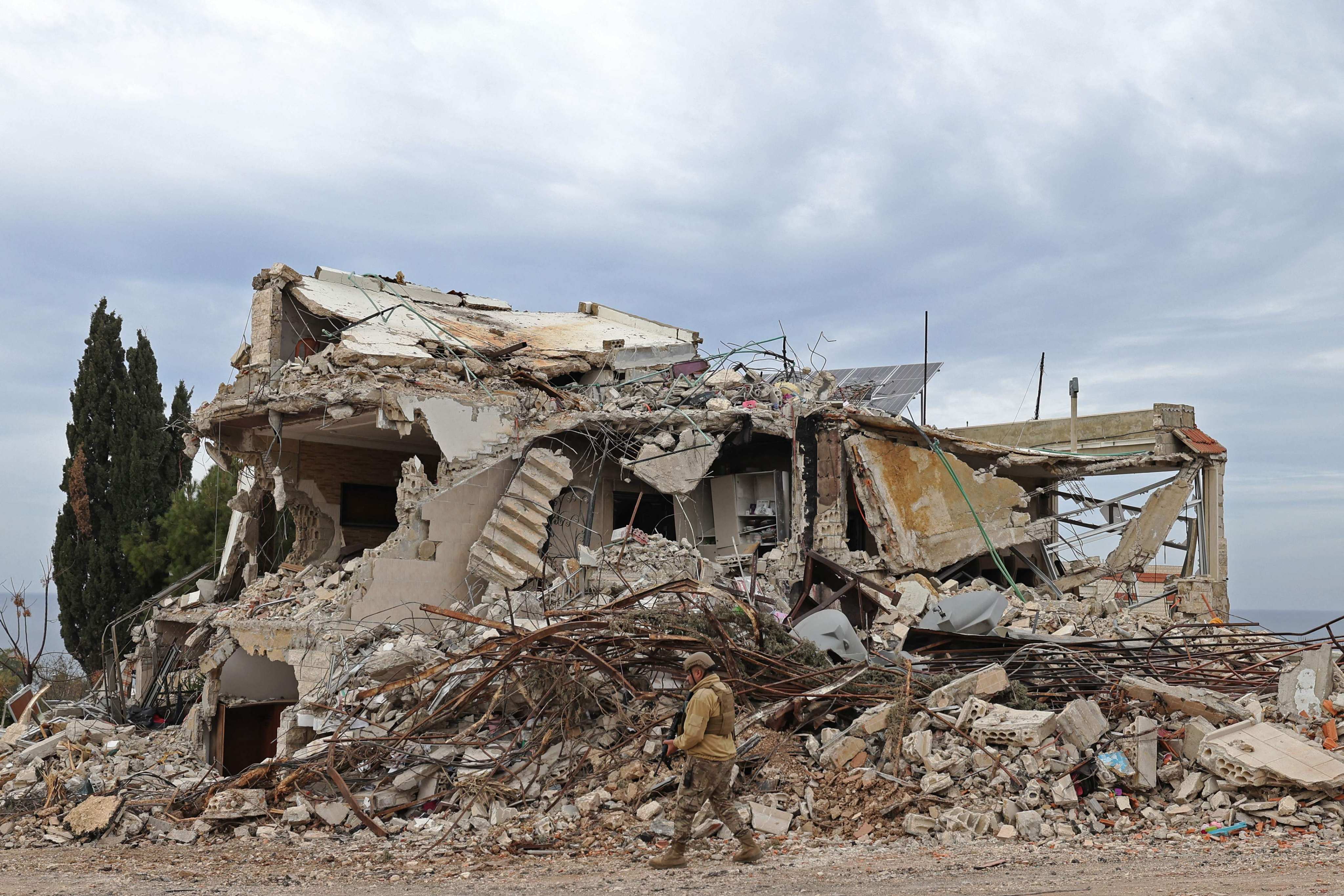 A Lebanese soldier patrols in a residential area that was devastated by the war between Israel and Hezbollah, in the southern coastal town of Naqura. Photo: AFP