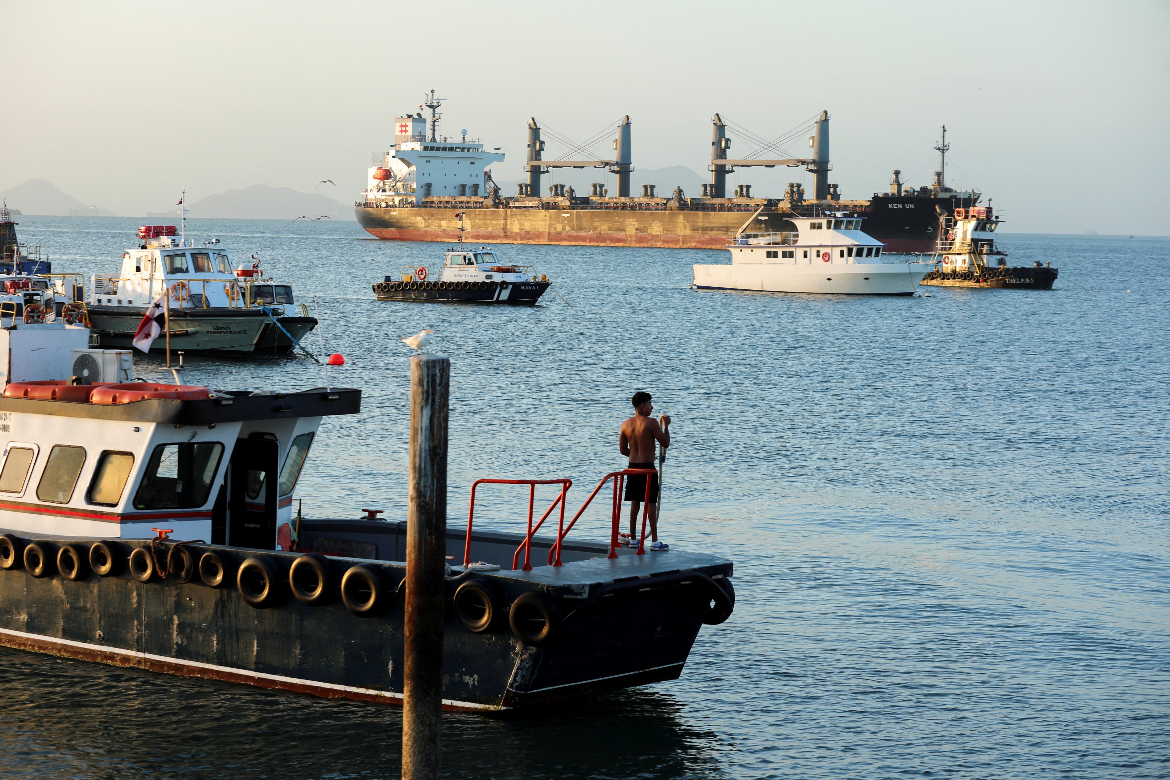 A cargo ship sails towards the Bridge of the Americas, which spans the entrance to the Panama Canal, on January 22. Since 2023, persistent disruptions at maritime chokepoints including the Panama Canal have intensified inflation, prolonged shipping times and strained economies. Photo: Reuters