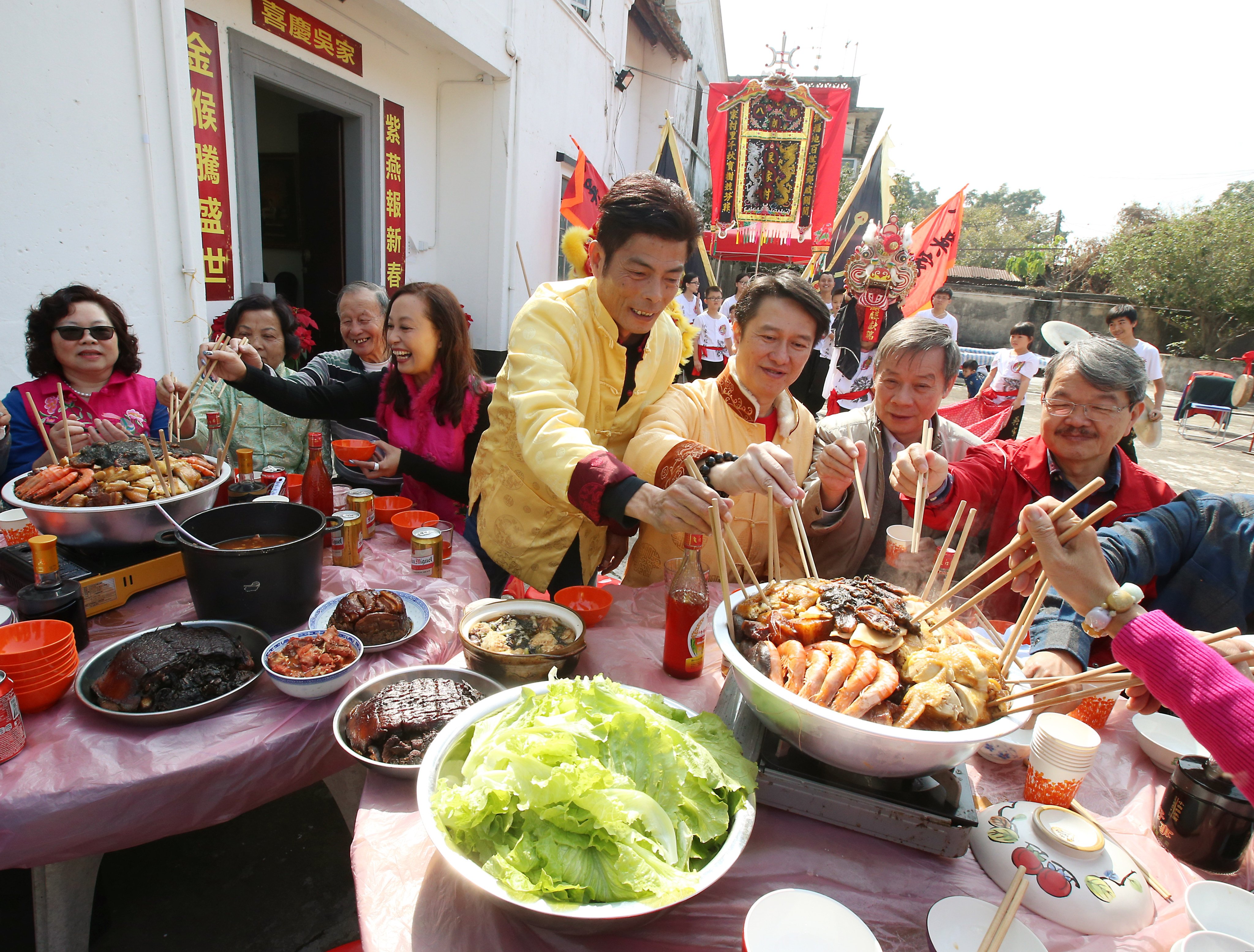 Residents of Ng Ka Tsuen, in Yuen Long, Hong Kong, enjoy a Lunar New Year poon choi meal. Photo: David Wong