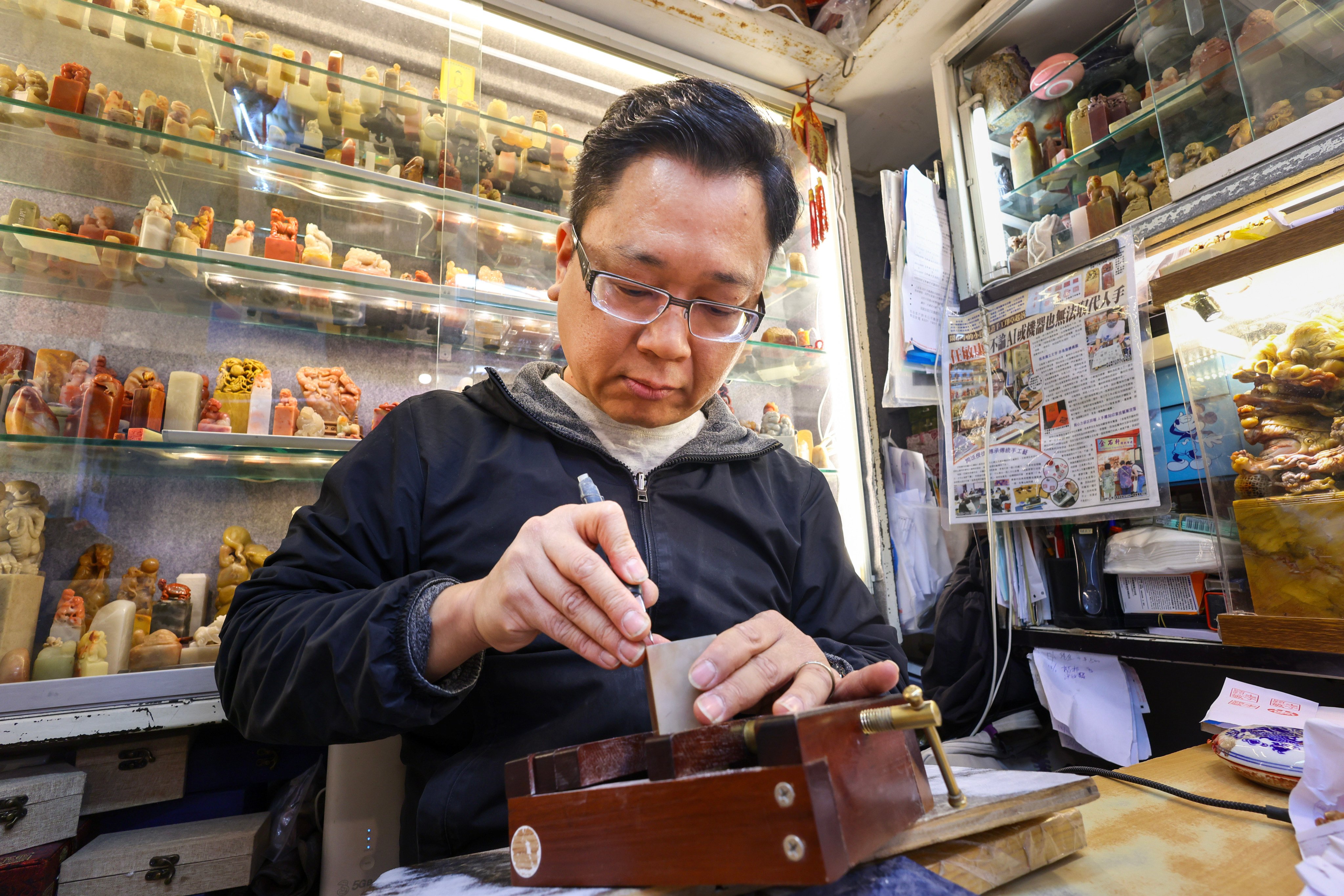 Yam Man-hong, a stone seal carver at Kingstone Engraving in Hong Kong. Photo: Dickson Lee