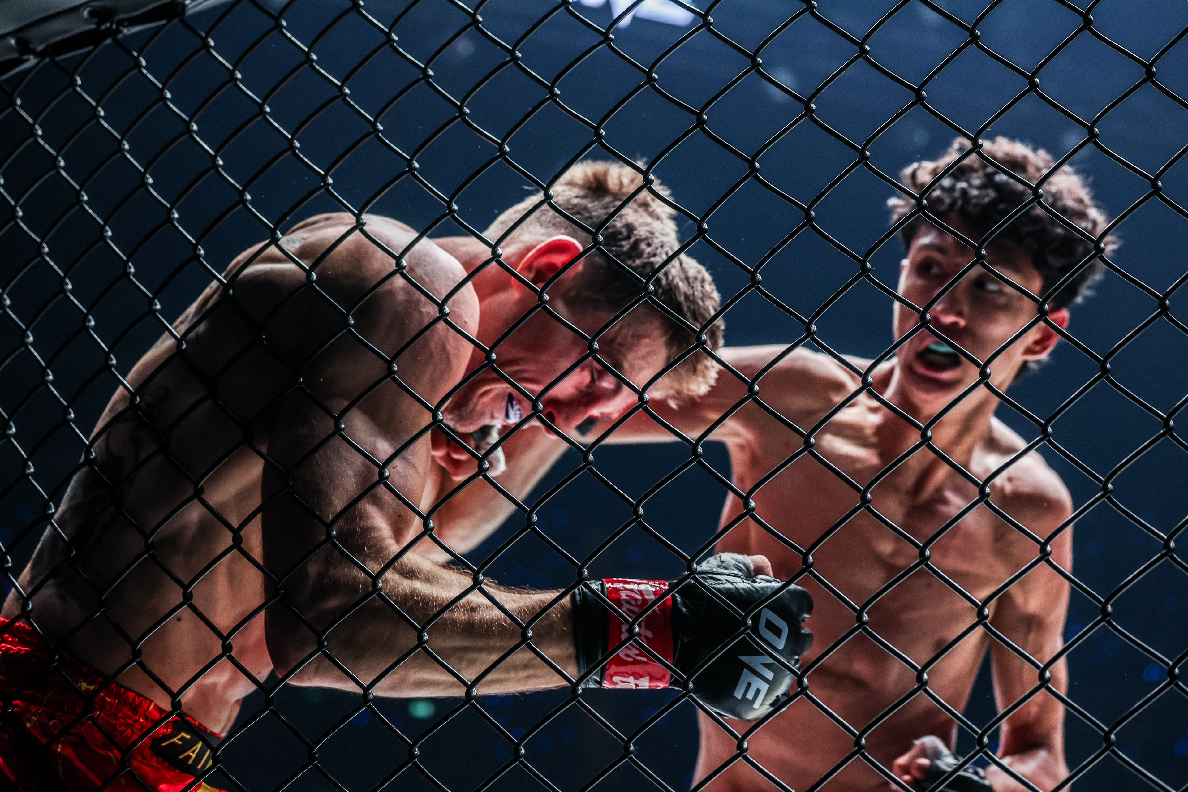 Nabil Anane traps Nico Carrillo against the cage during their ONE Interim Bantamweight Muay Thai World Championship fight at ONE 170 in Bangkok. Photo: ONE Championship