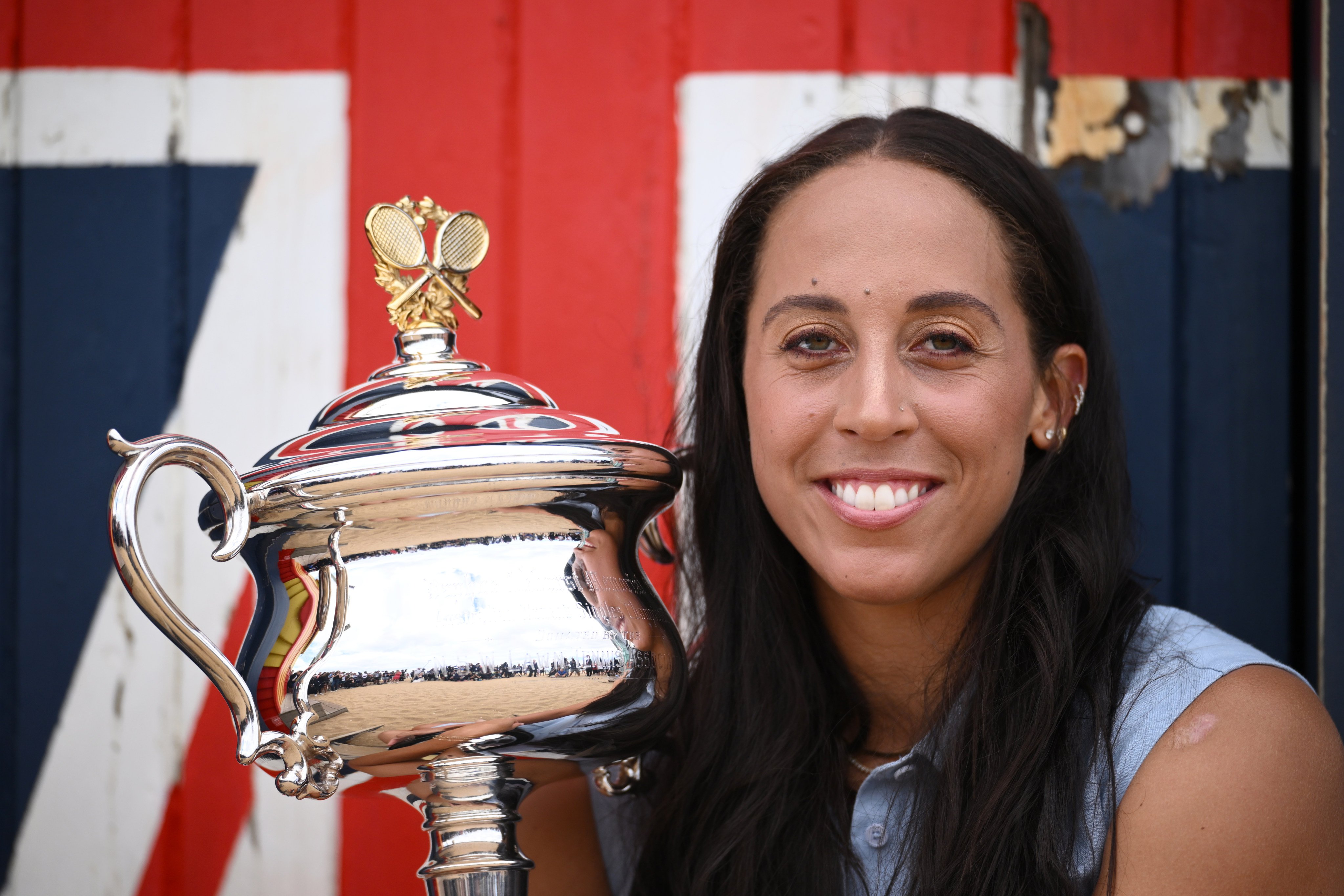 Madison Keys poses with the cup in Melbourne the day after her maiden grand slam singles triumph. Photo: dpa