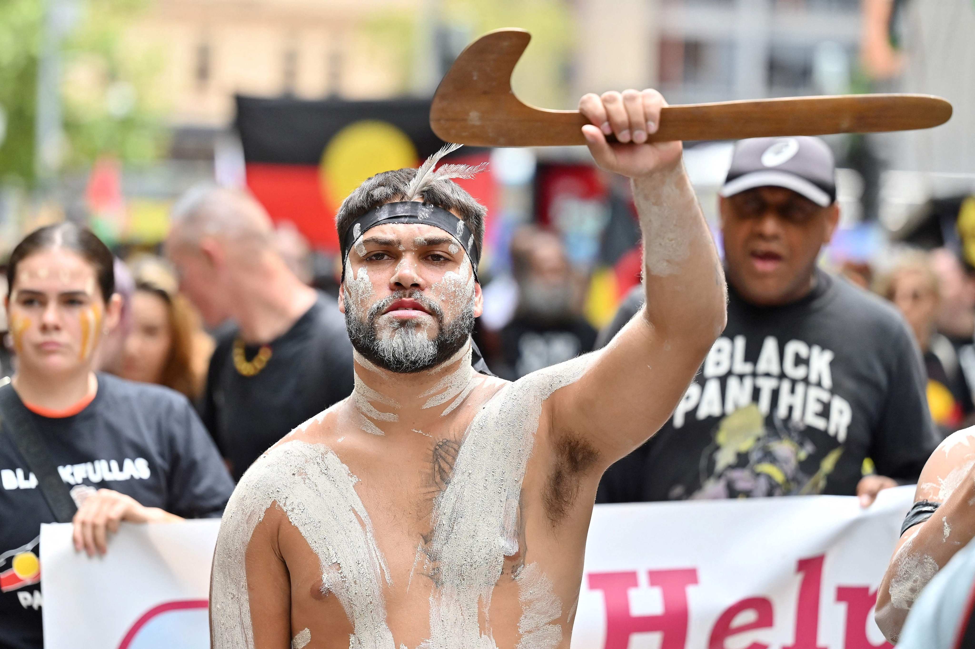 An Aboriginal Australian protestor marches during the annual ‘Invasion Day’ protest through the streets in Sydney on Sunday. Photo: AFP