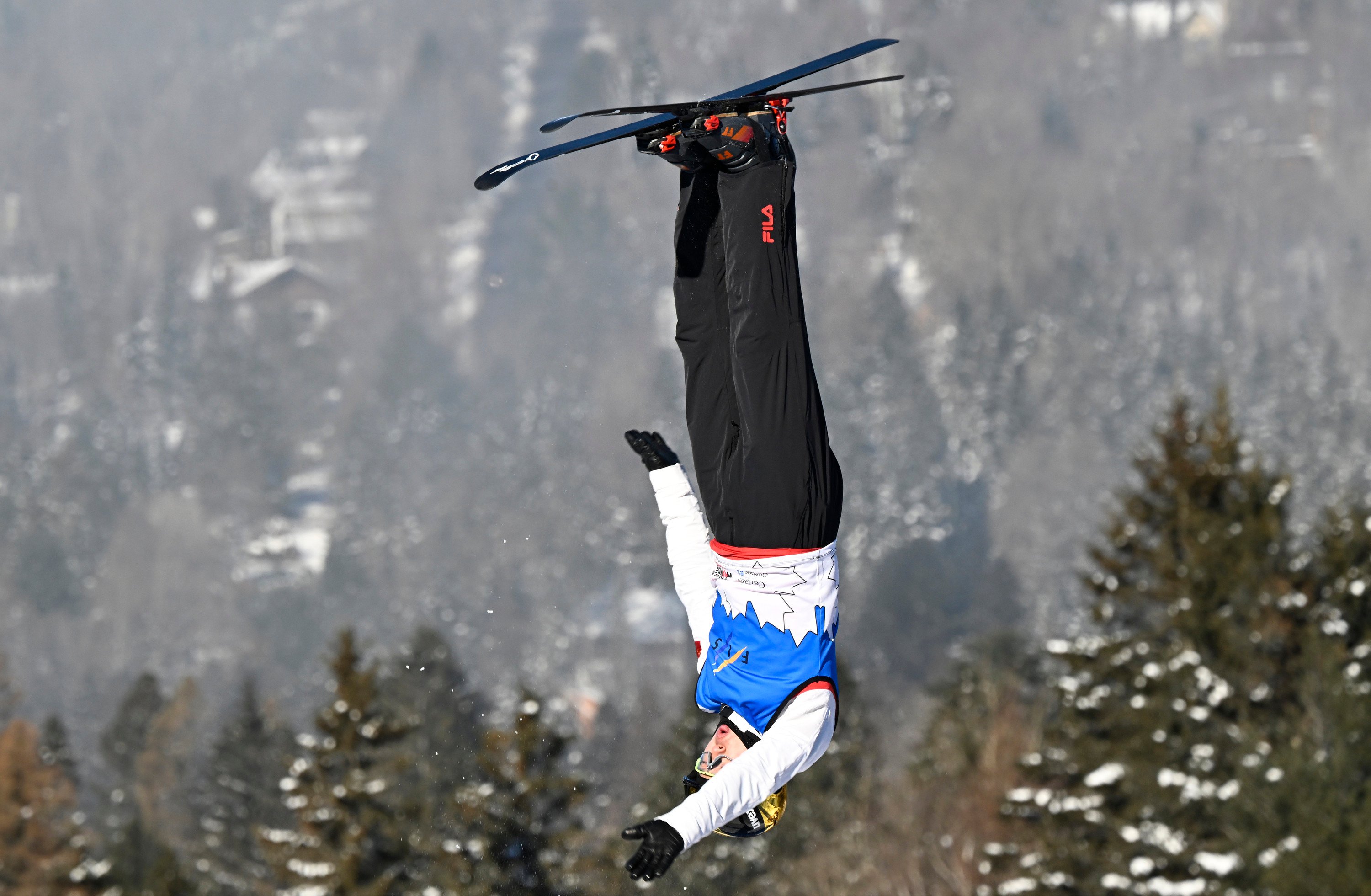 Qi Guangpu of China competes in the World Cup aerials event in Lac-Beauport. Photo: AP