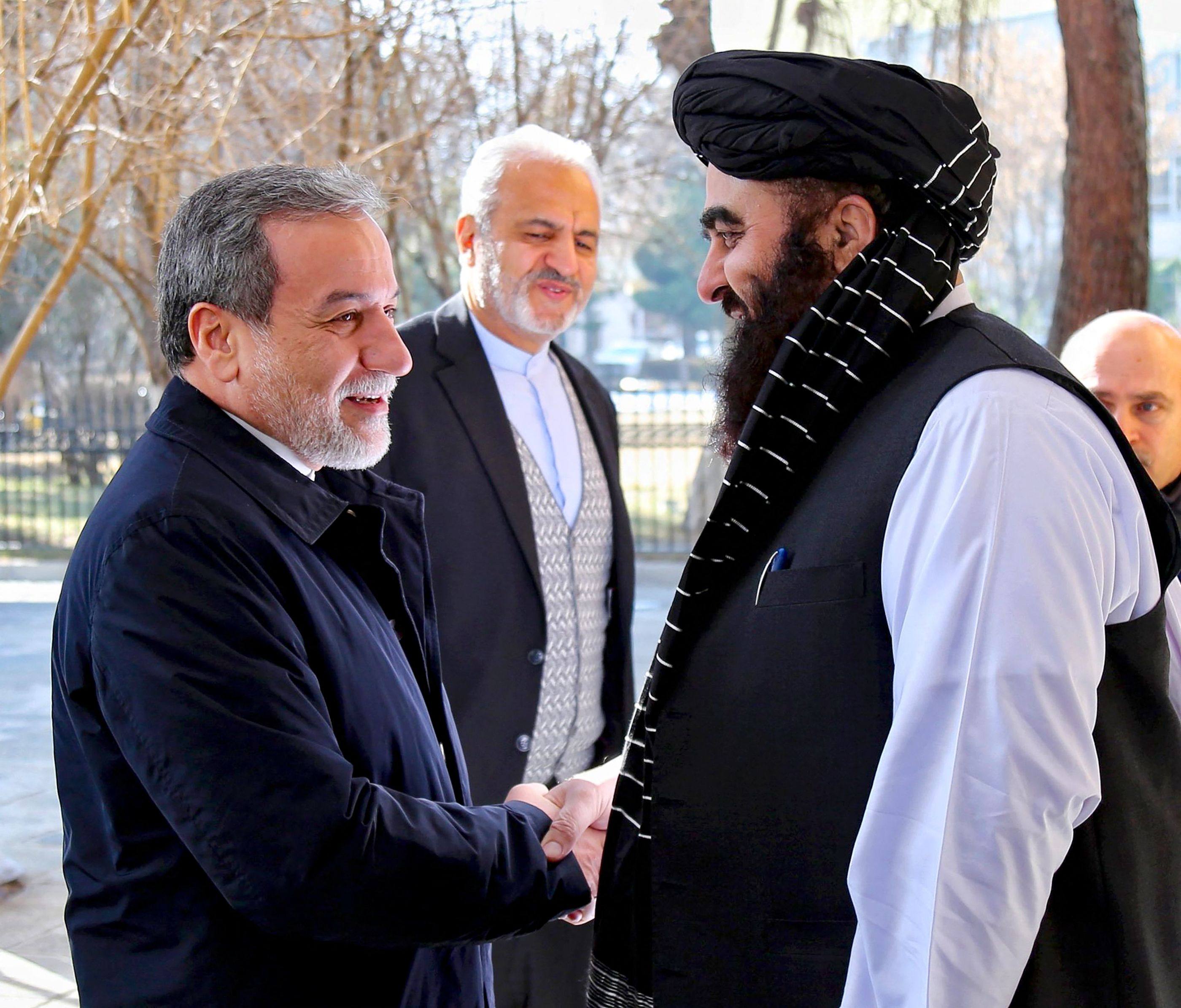 Afghanistan’s Minister of Foreign Affairs Amir Khan Muttaqi (right) shaking hands with his Iranian counterpart Abbas Araghchi at the foreign ministry in Kabul on Sunday. Photo: AFP