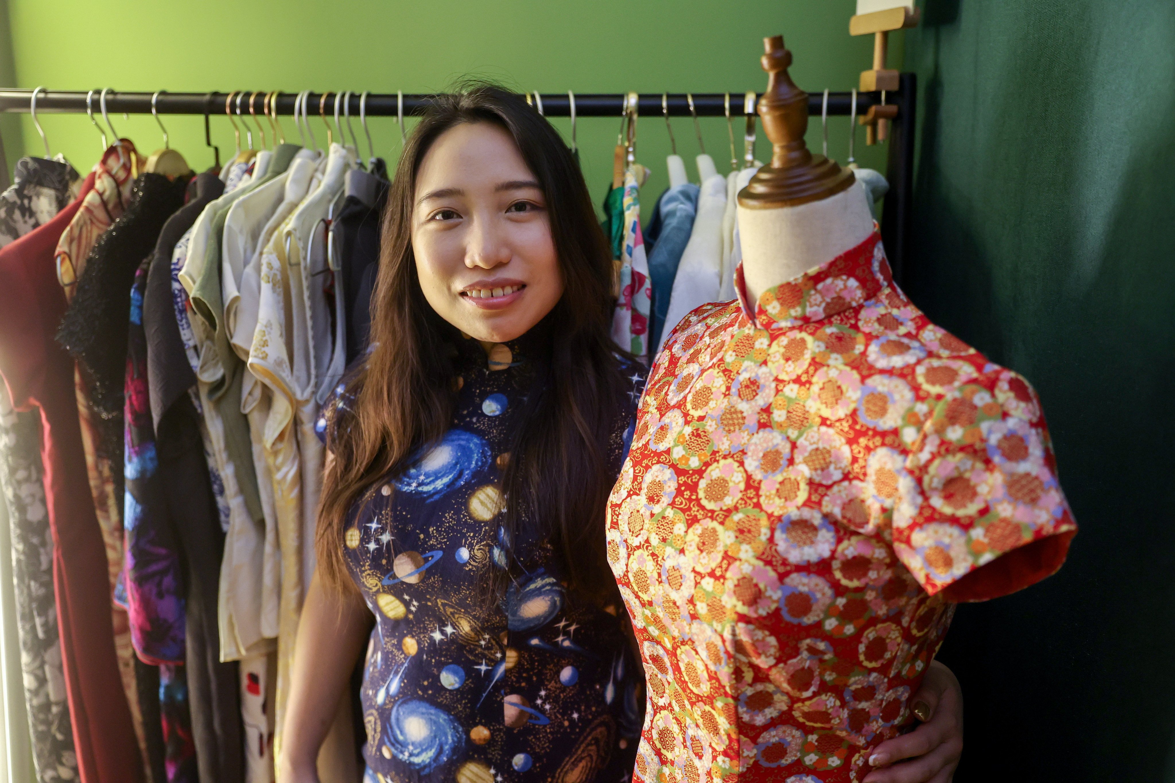 Cheongsam maker Chocolate Tsang poses in one of her creations at her studio, Stand Tall D, in Kwai Chung, Hong Kong. Photo: Edmond So