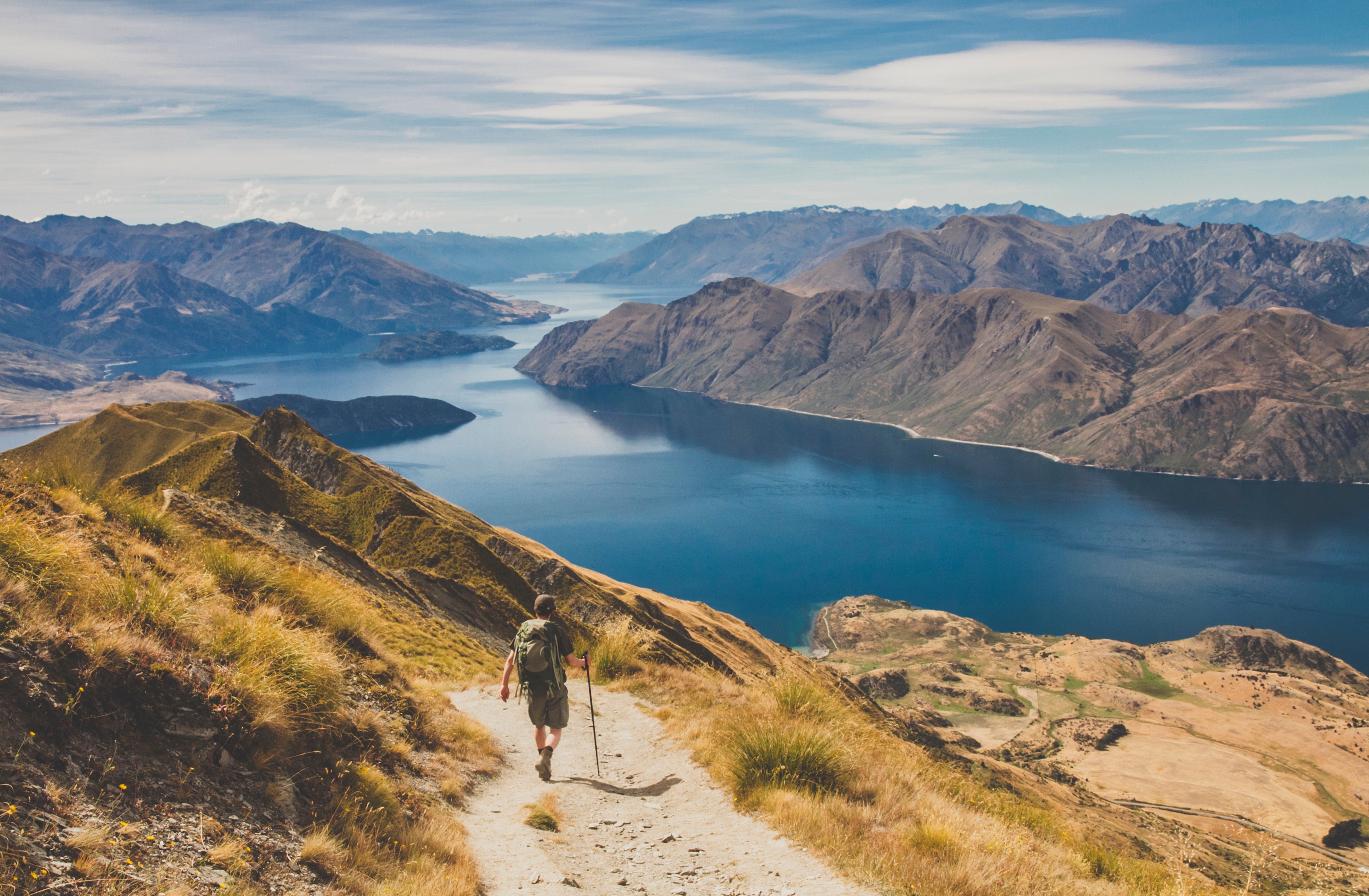 A man hikes at Roys Peak near Lake Wanaka on New Zealand’s South Island. Photo: Getty Images