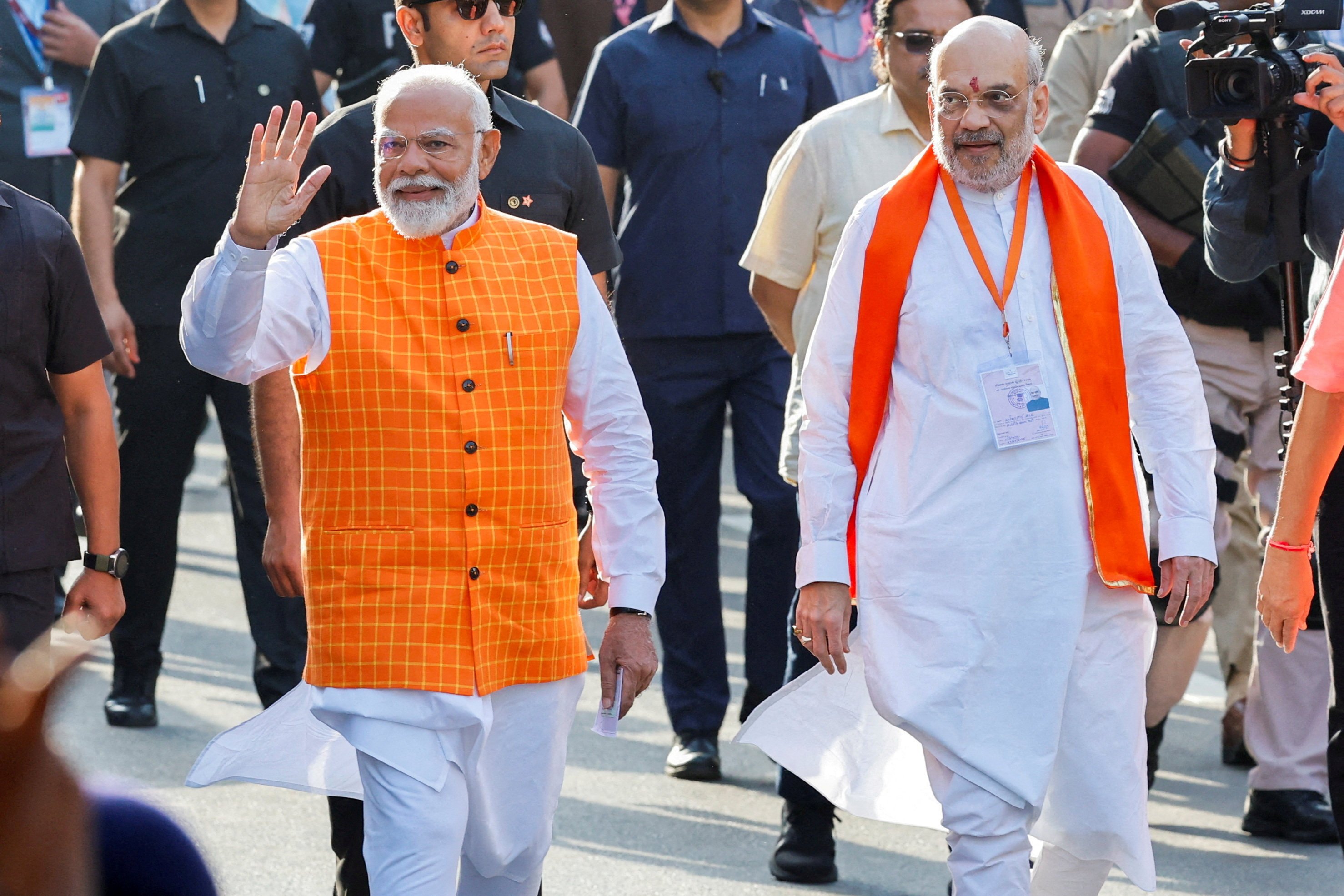 India’s Prime Minister Narendra Modi (left) walks alongside Amit Shah, Indian Home Minister in Ahmedabad, India on  May 7, 2024. Photo: Reuters