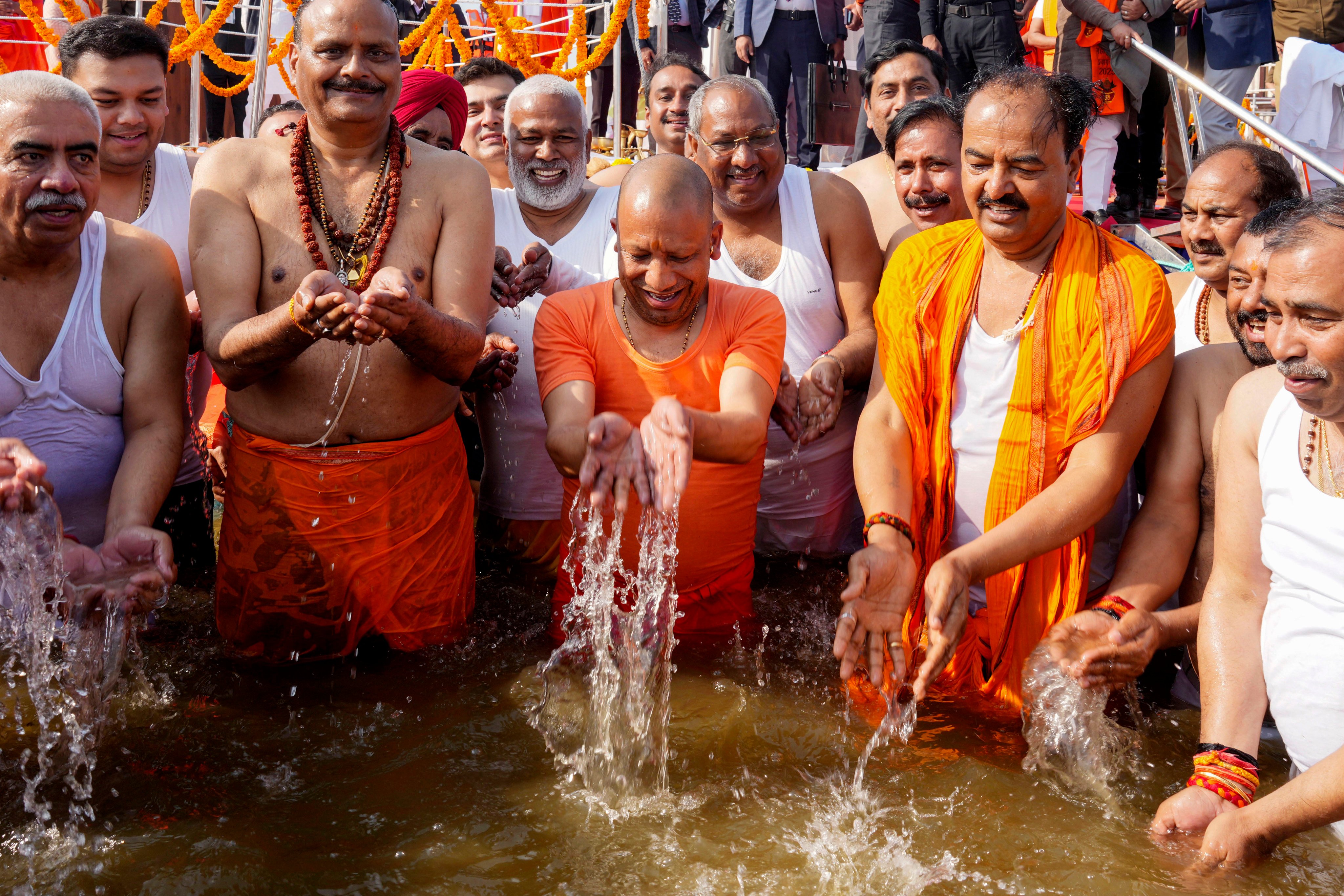 Uttar Pradesh Chief Minister Yogi Adityanath (centre), with cabinet ministers taking a bath at Sangam, the confluence of the rivers Ganges and the Yamuna and mythical Saraswati river, in Prayagraj, in the northern Indian state of Uttar Pradesh on January 22 during the Maha Kumbh Mela festival. Photo: AP