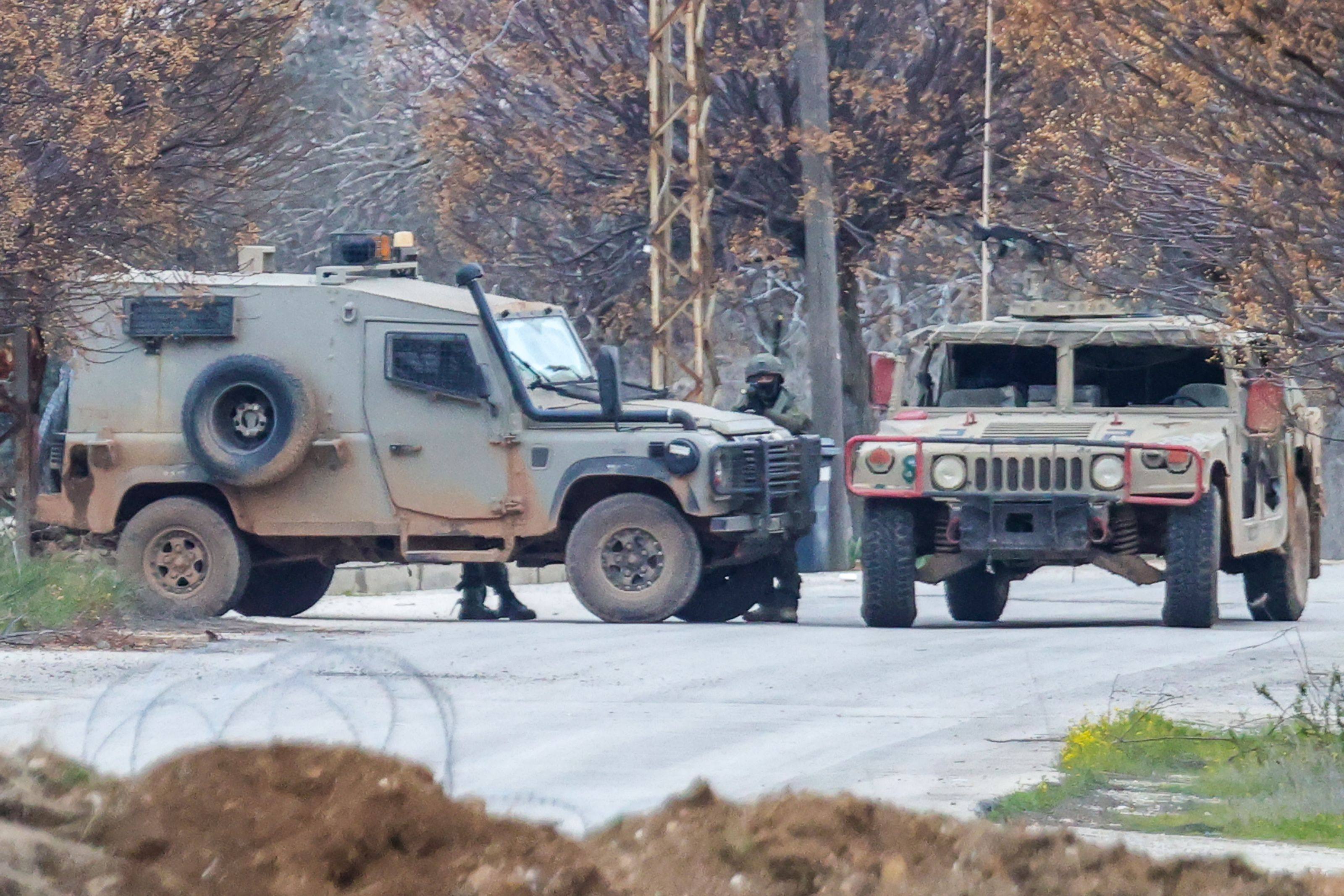 Israeli soldiers secure a roadblock near the southern Lebanese village of Kfar Kila. Photo: AFP