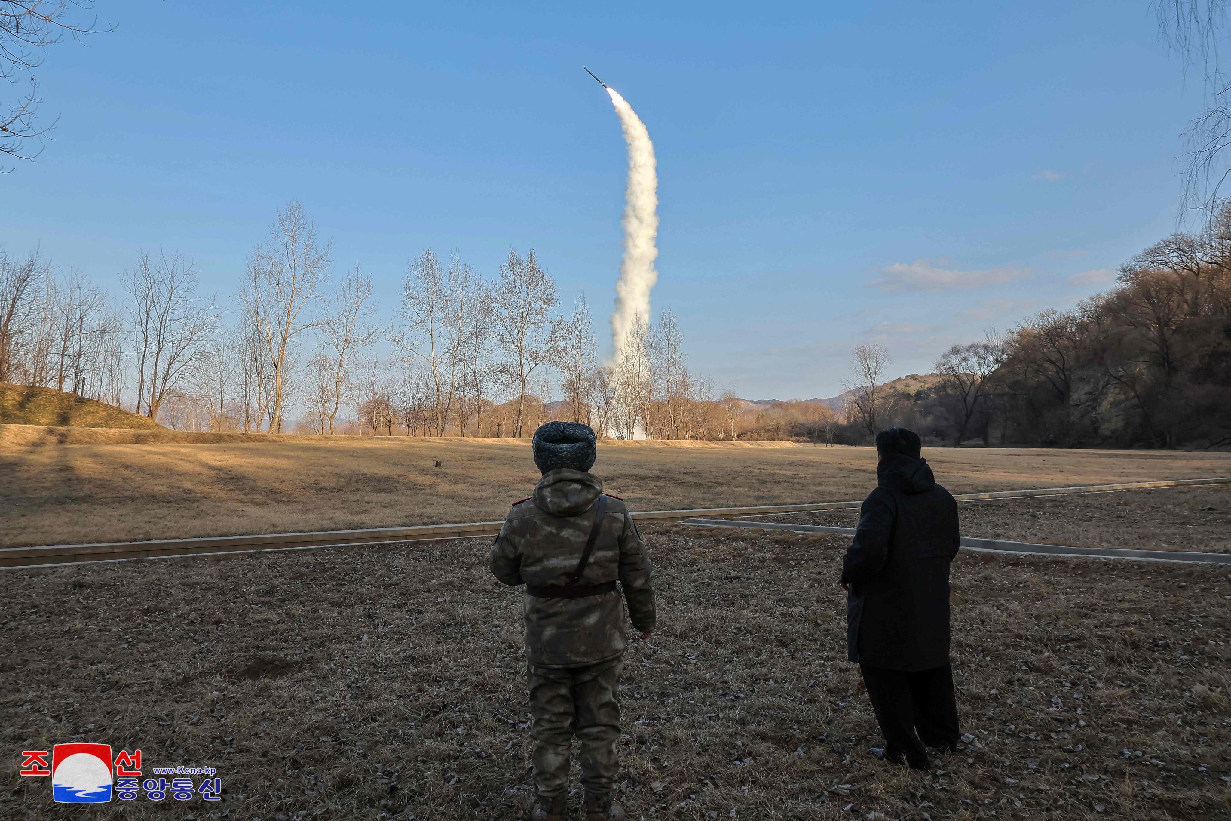 North Korean leader Kim Jong-un (right) oversees the test-firing from underwater of a strategic cruise and guided weapon at an undisclosed location in a photograph released by state media on Sunday. Photo: KCNA via KNS/AFP