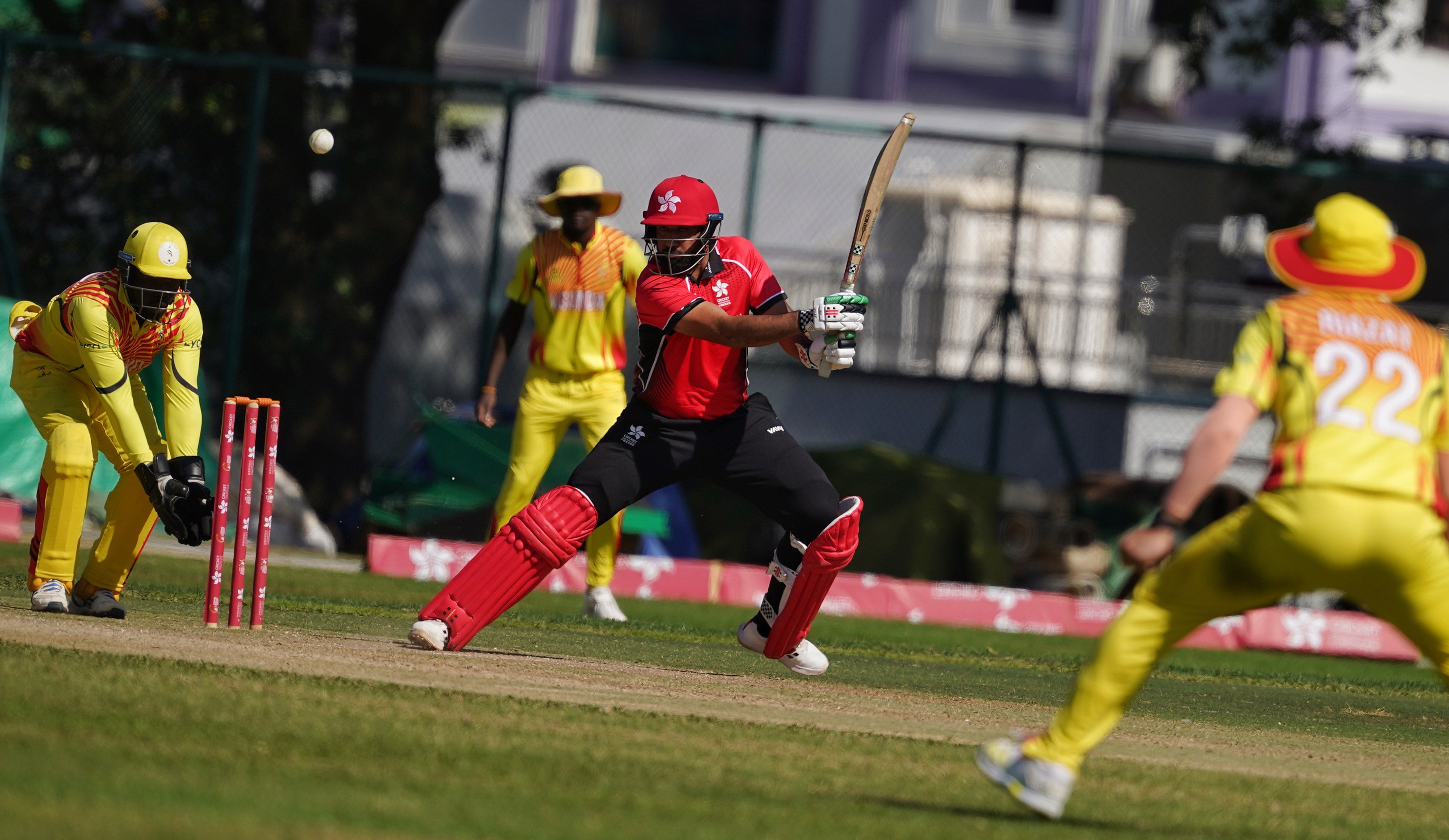 Nizakat Khan (in red) stars with the bat for Hong Kong against Uganda on Tuesday. Photo: Elson Li