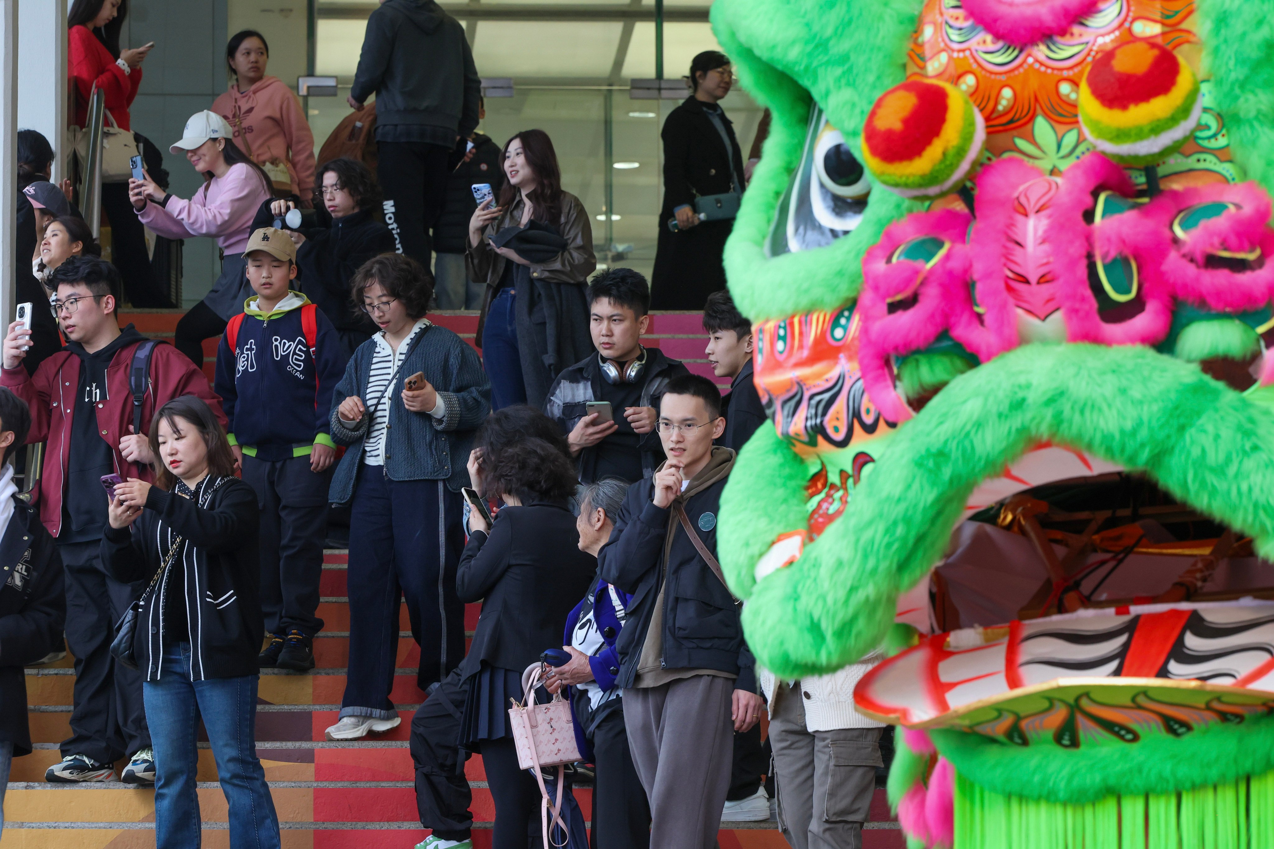 Tourists and locals view Lunar New Year decorations at Harbour City in Tsim Sha Tsui. Photo: Dickson Lee