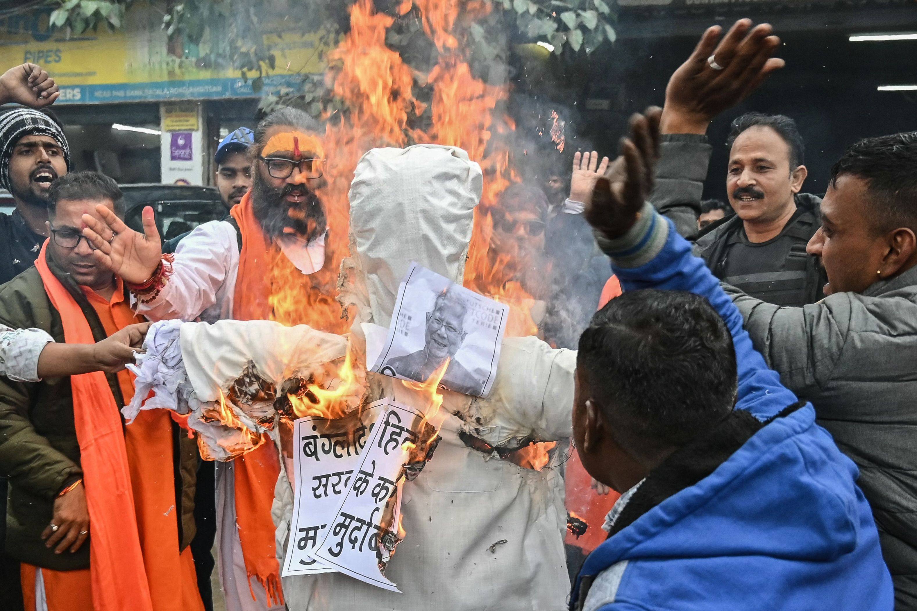 Activists and supporters of Shiv Sena Taksali, a right-wing organisation, burn an effigy of Muhammad Yunus, chief adviser of Bangladesh, in Amritsar on December 27, during a protest against the recent attacks on Hindus in Bangladesh. Photo: AFP