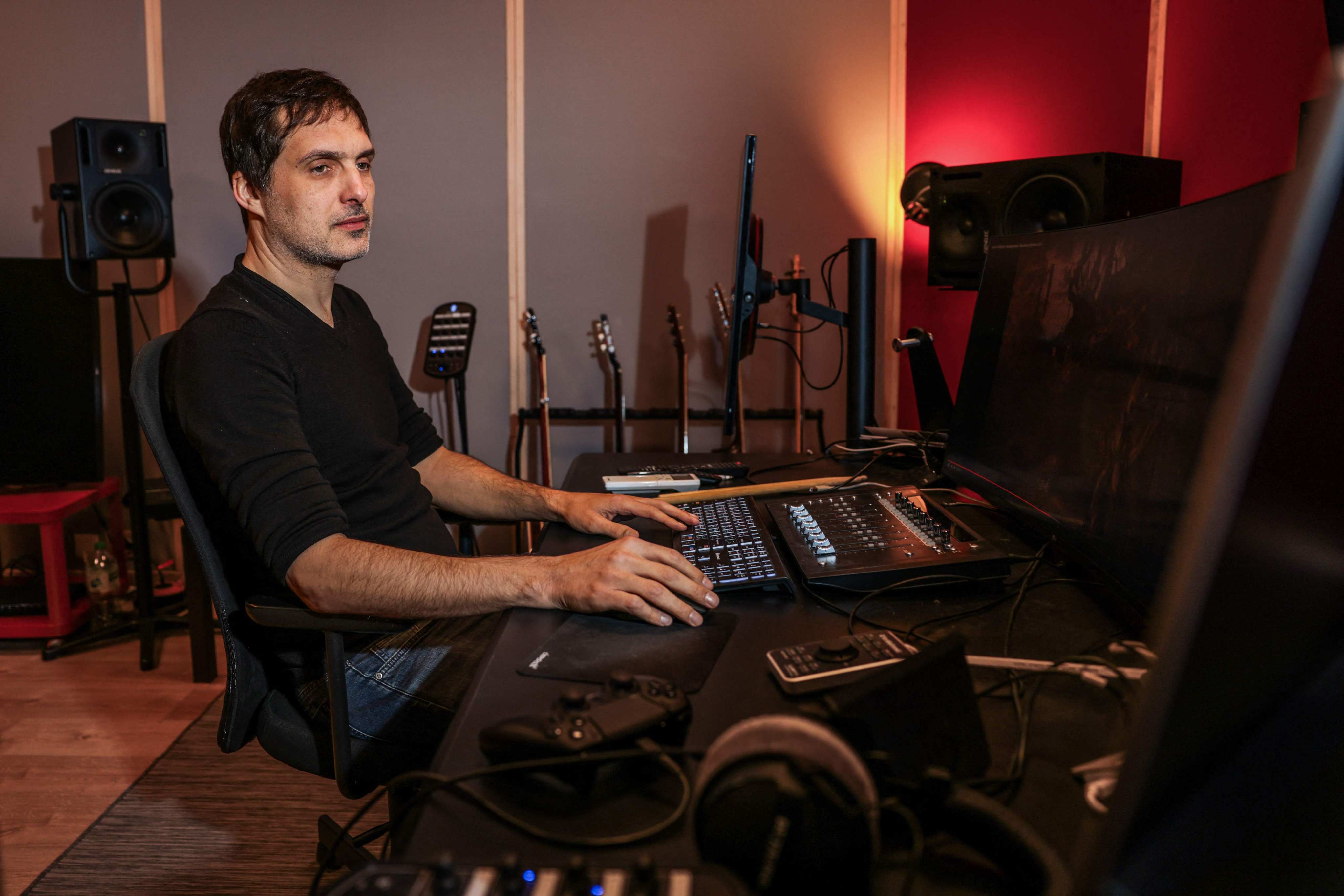 French video game music composer Olivier Deriviere, who has worked on games including Assassin’s Creed IV,  A Plague Tale: Innocence, Streets of Rage 4 and Dying Light 2 Stay Human, works in his recording studio in Malakoff, on the outskirts of Paris, on January 14, 2025. Photo: AFP