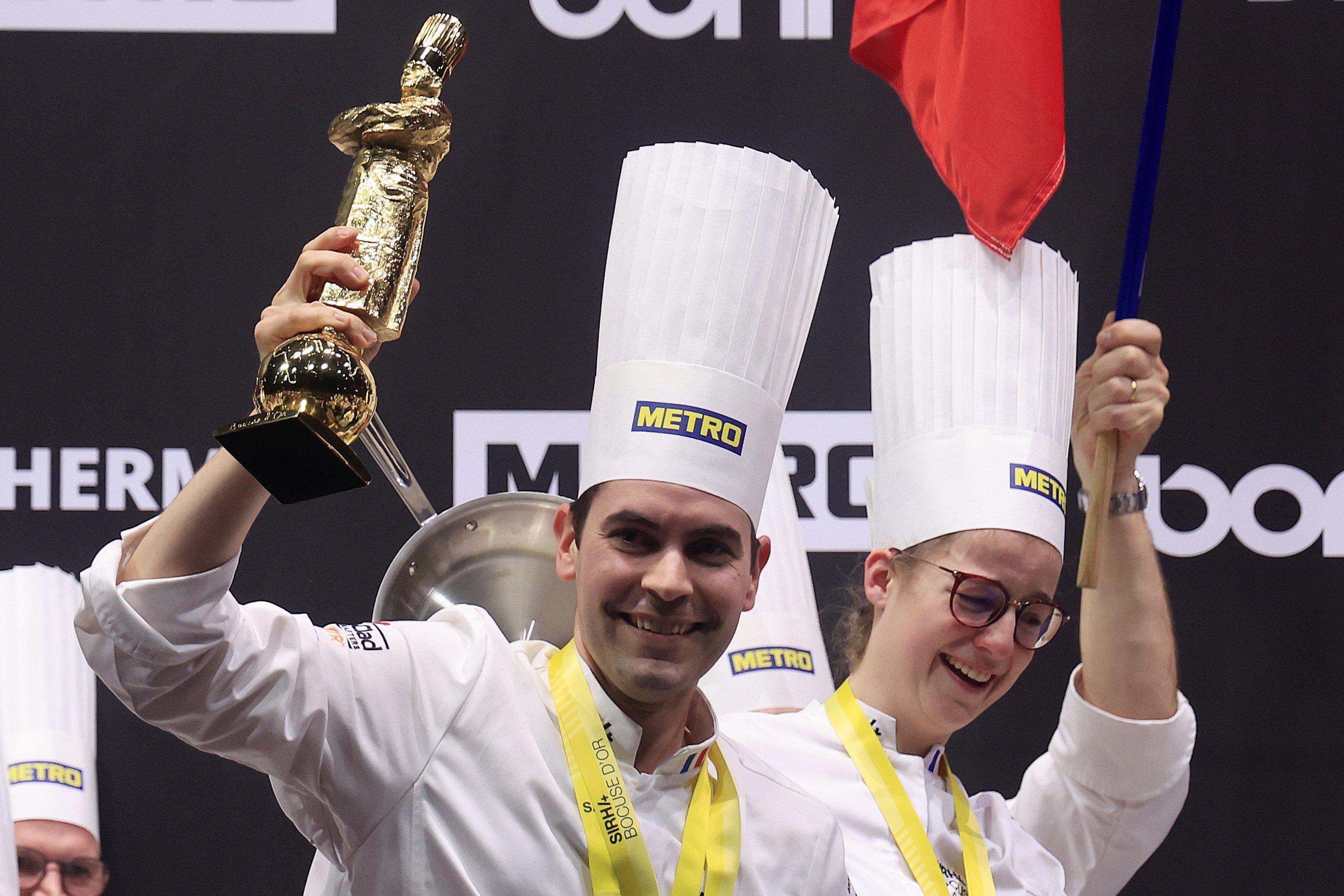 Paul Marcon (centre) of France holds the first-place trophy of the Bocuse d’Or gastronomy contest at the Eurexpo Lyon Convention Centre in Lyon, France, on January 27, 2025. Photo: EPA-EFE