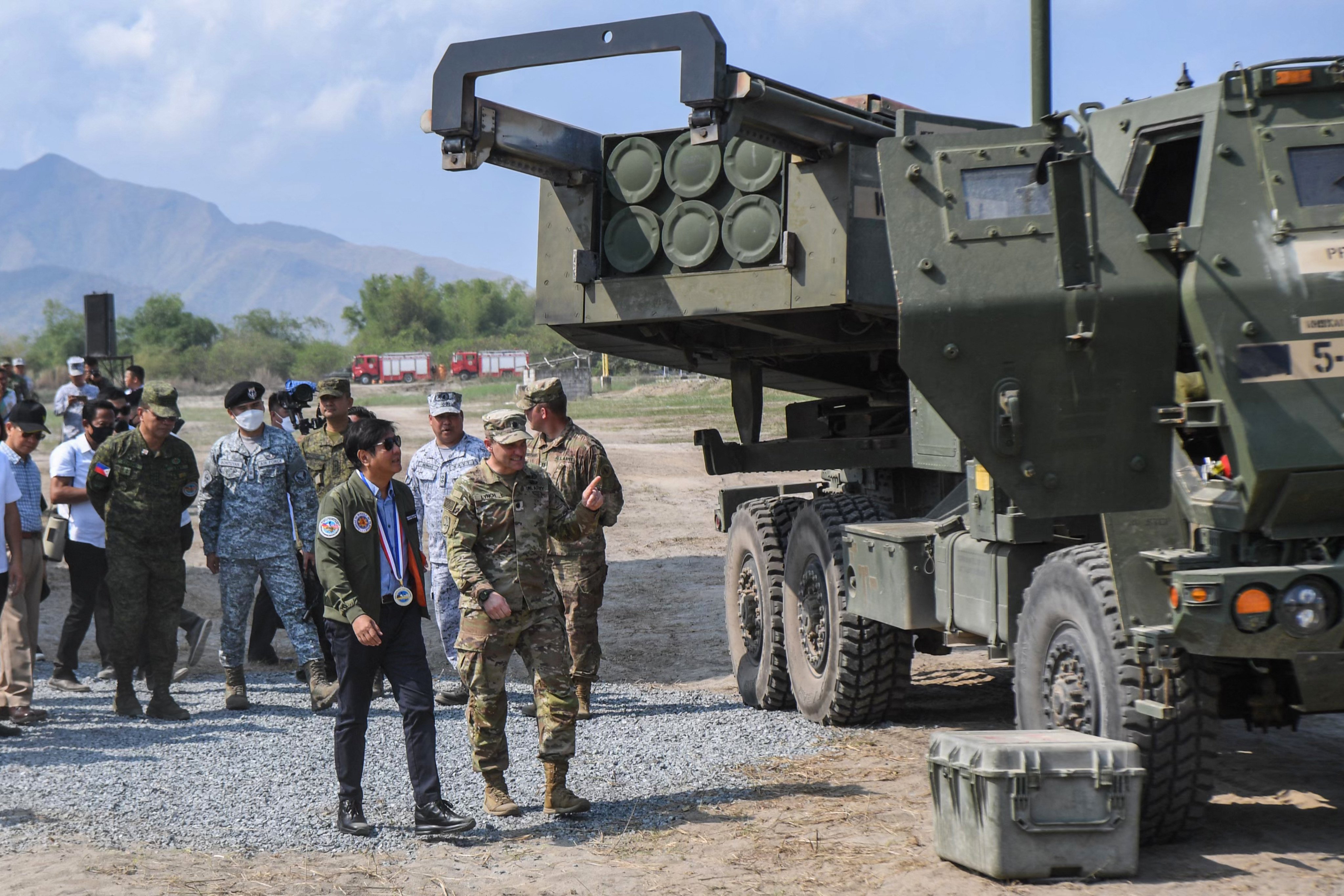 Philippine President Ferdinand Marcos Jnr, (left)) accompanied by a US soldier inspects a high mobility artillery rocket system on April 26, 2023. Photo: AFP