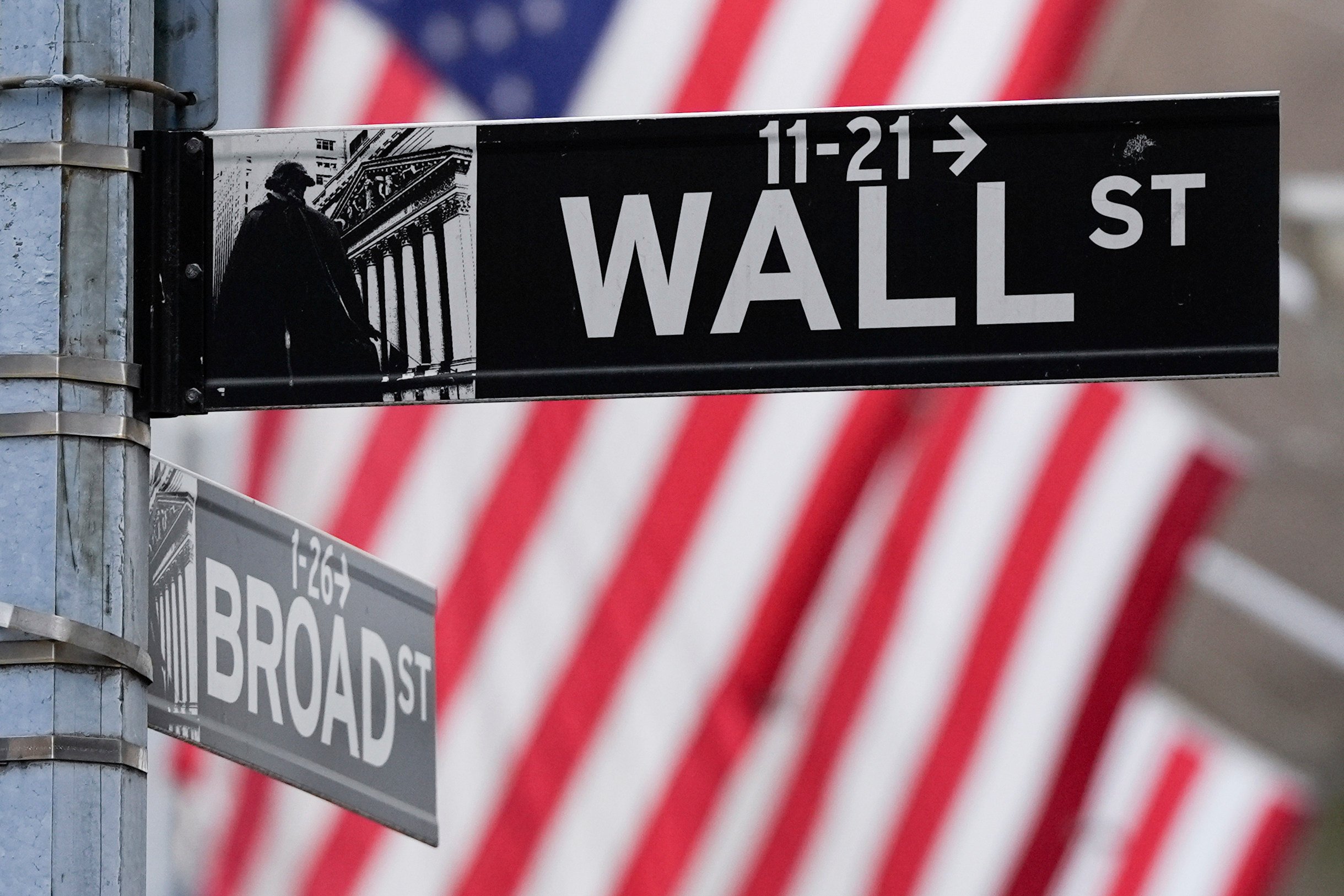 A sign outside the New York Stock Exchange marks the intersection of Wall Street and Broad Street on Tuesday. Photo: AP